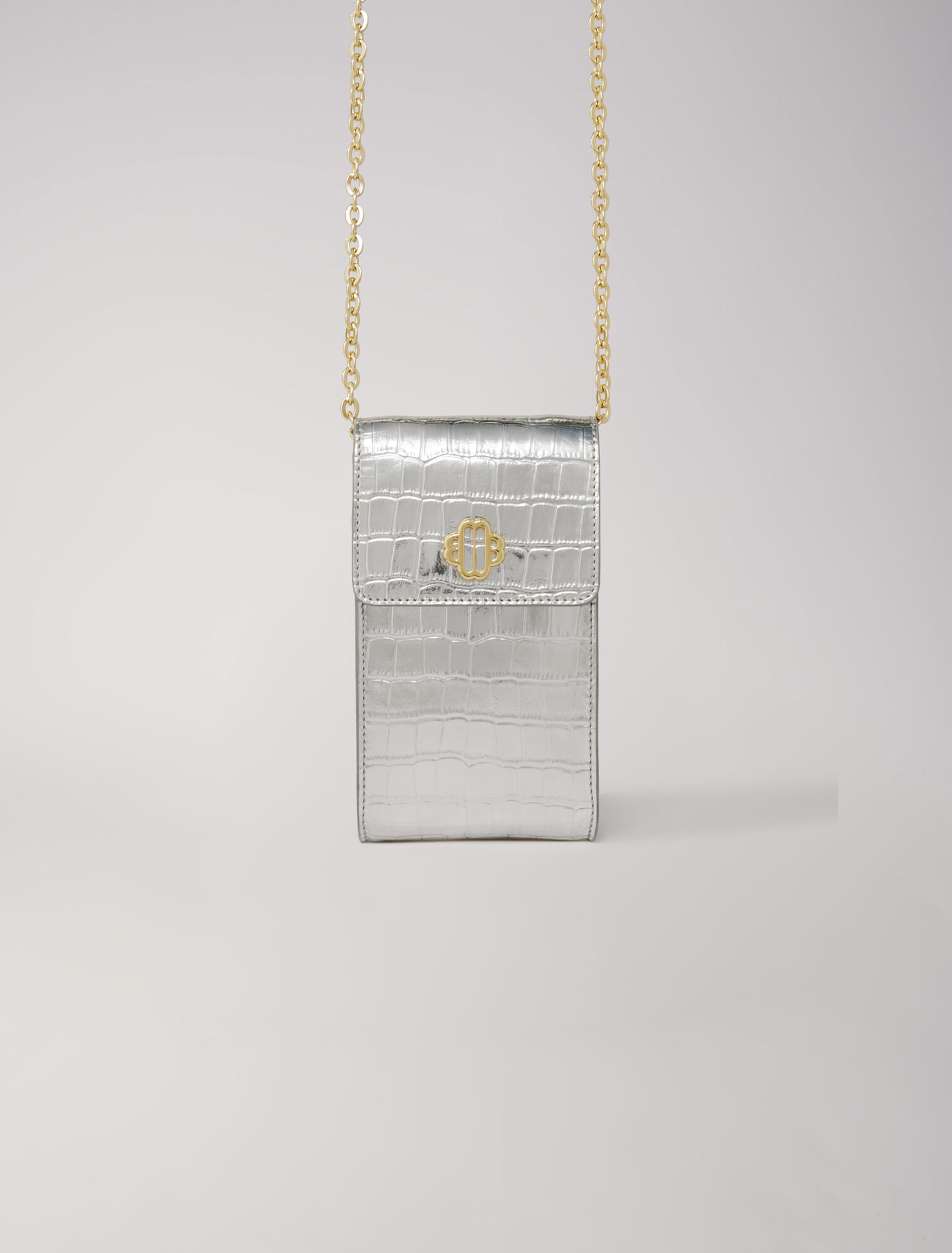 Metallic embossed leather clutch