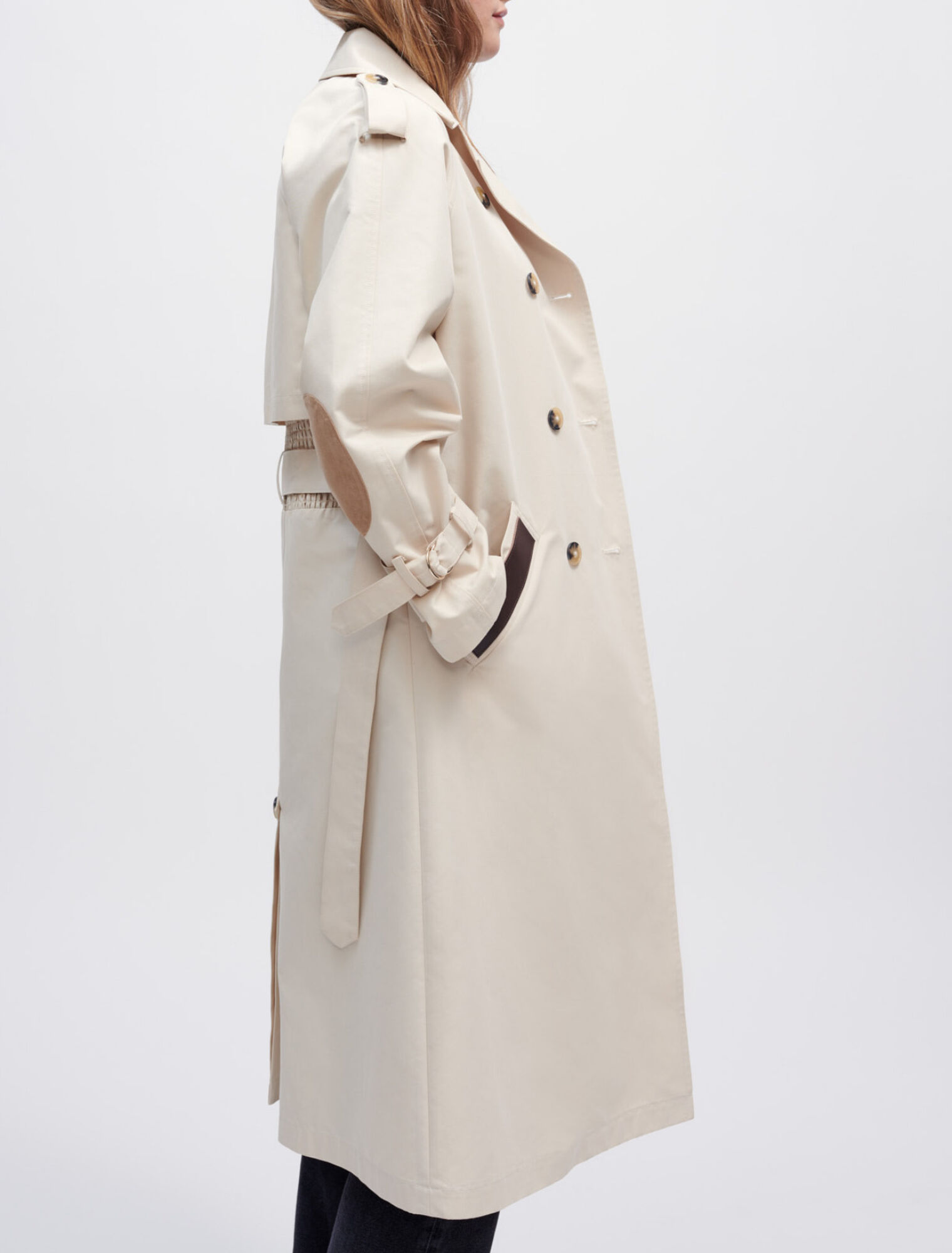 Trench coat with smocking at the back