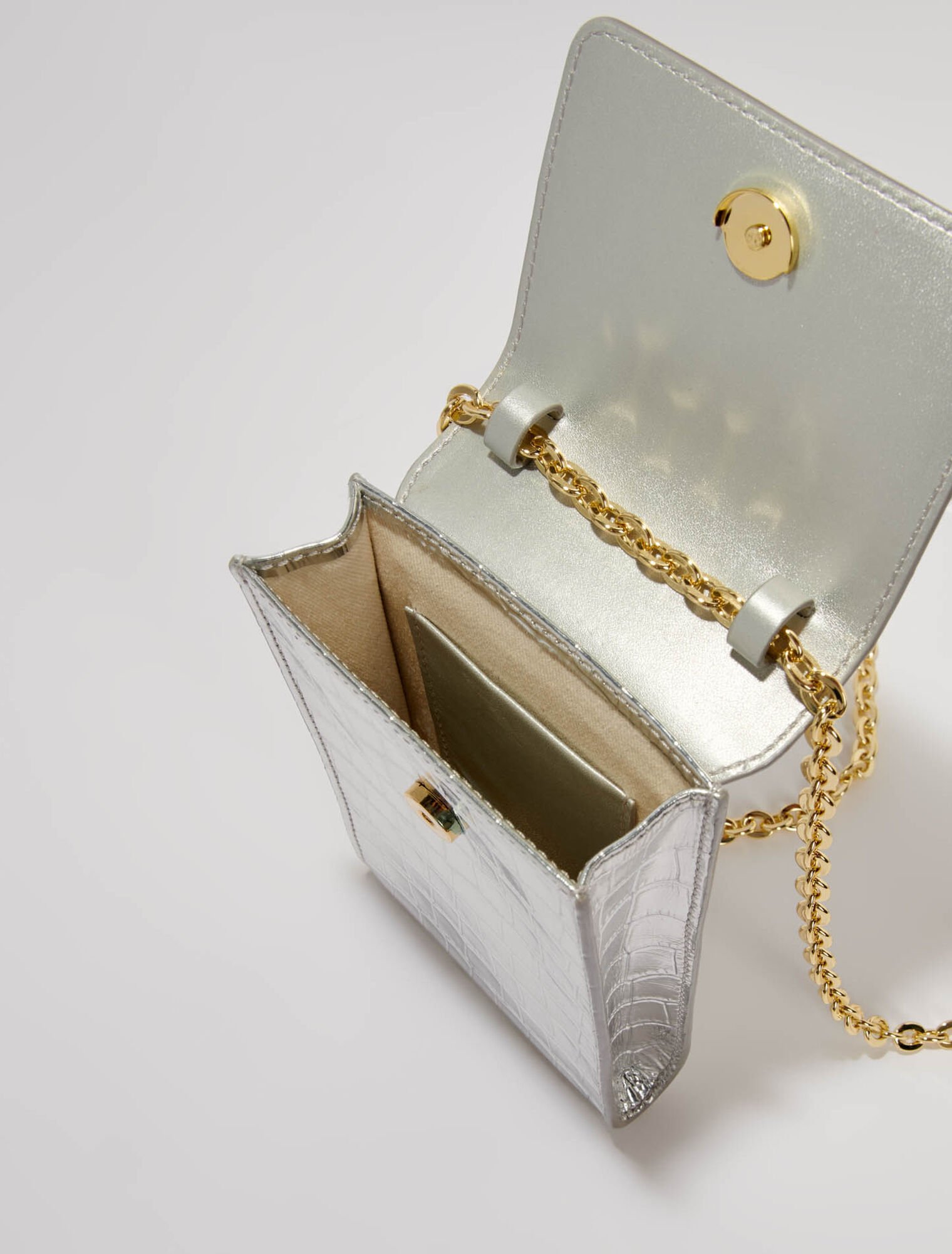 Metallic embossed leather clutch