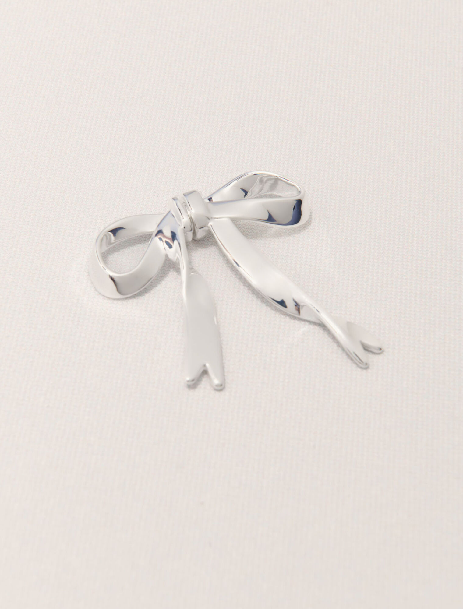 Silver bow earring