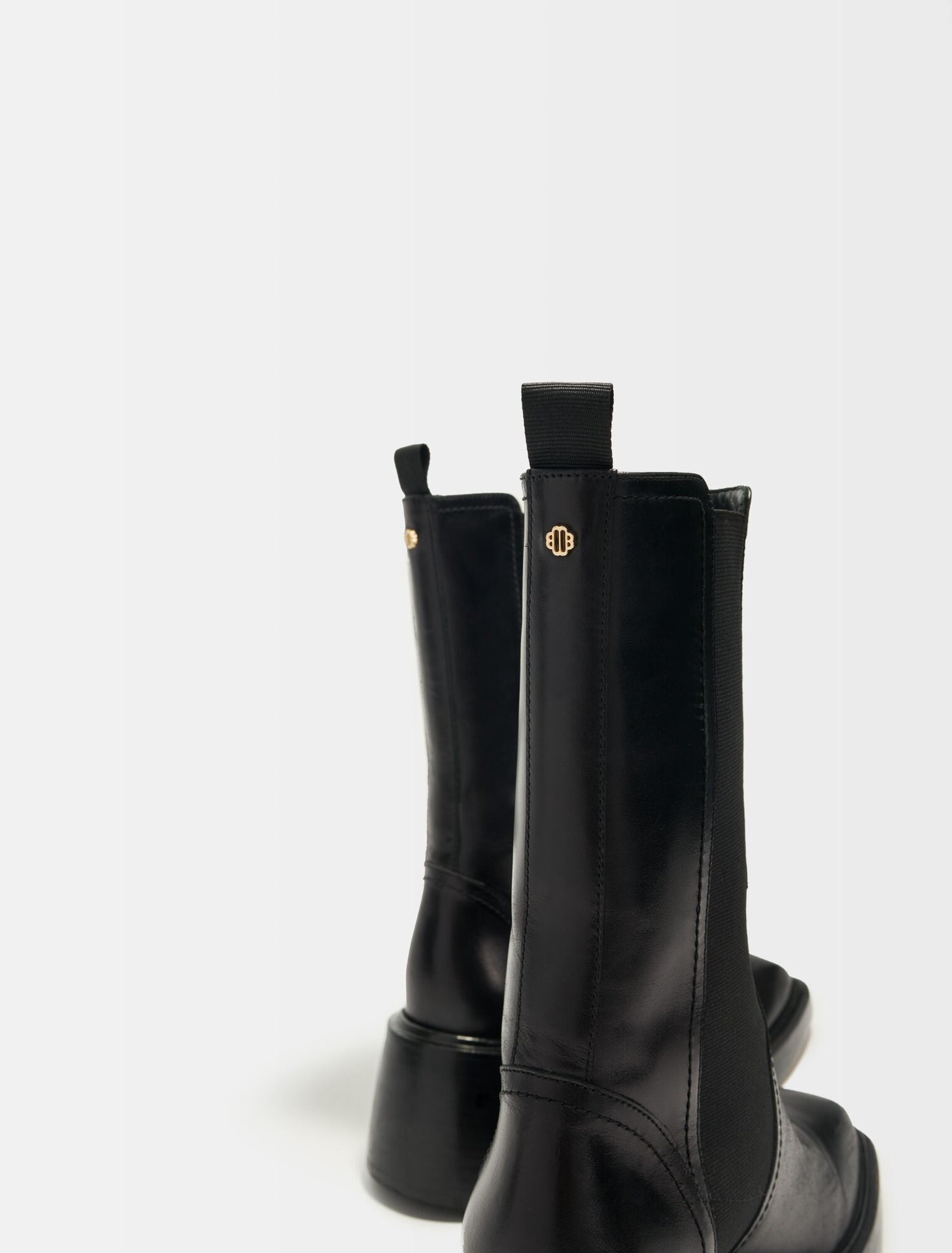 Black leather ankle boots and square toe