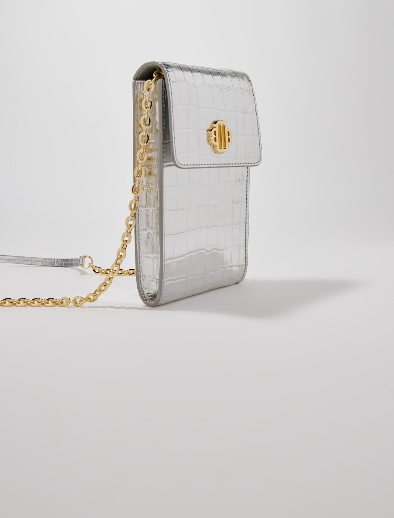 Metallic embossed leather clutch