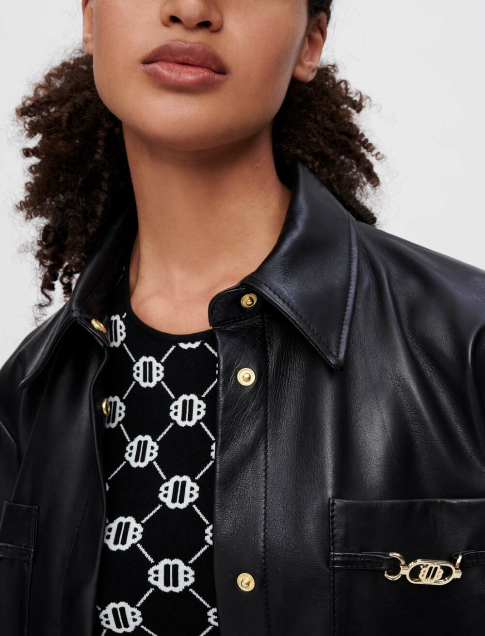 Black leather shirt with gold horsebits
