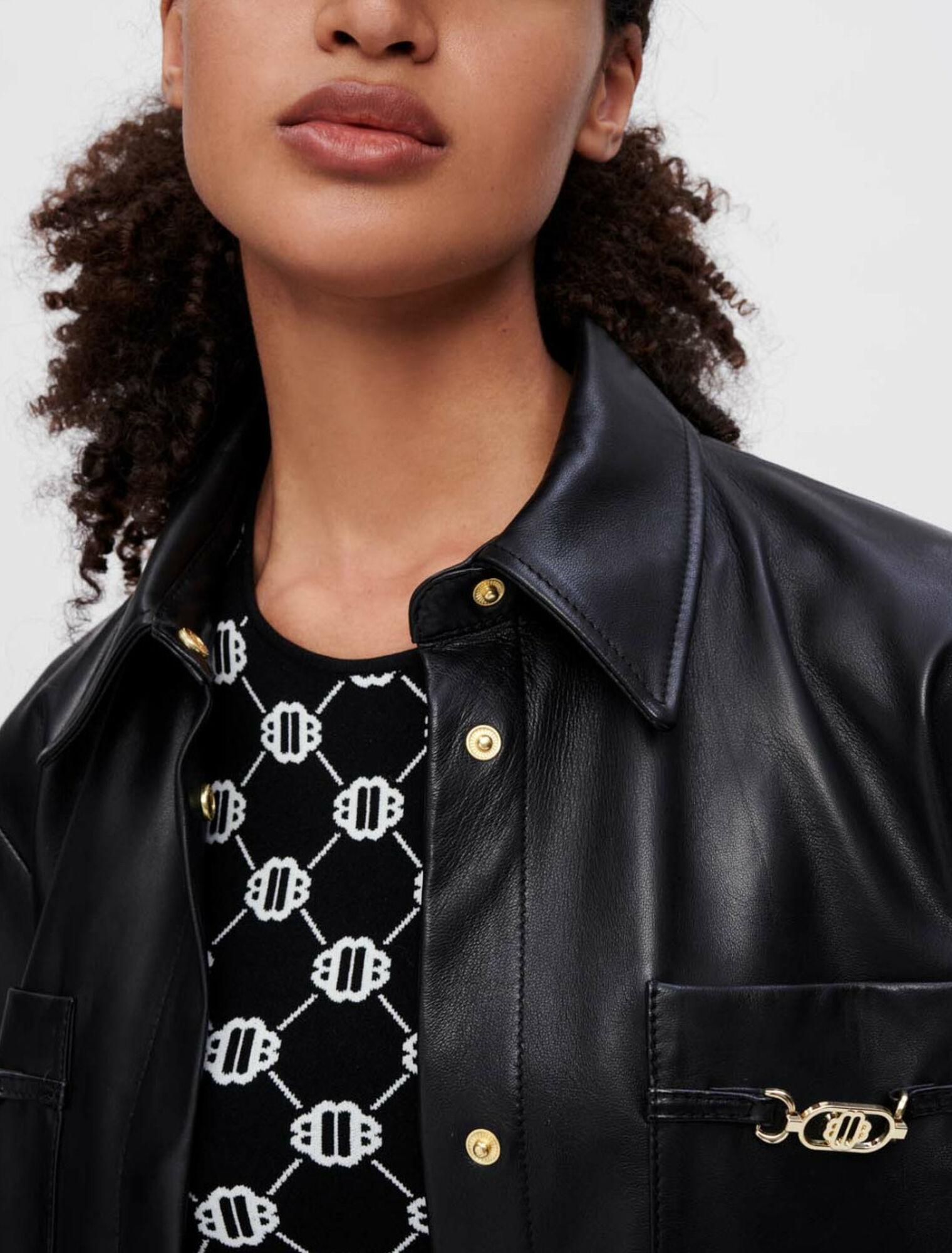 Black leather shirt with gold horsebits