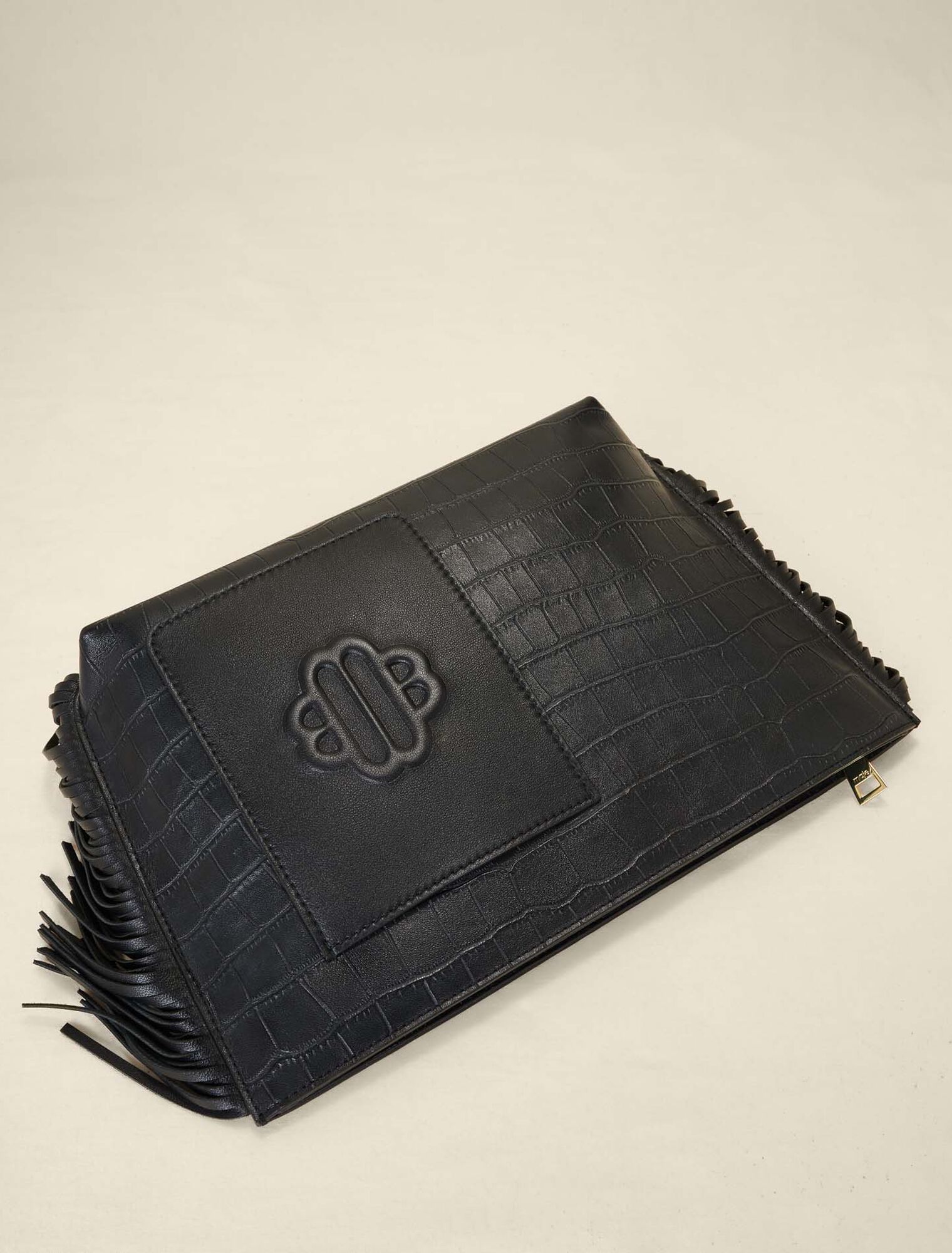 Embossed leather clutch bag