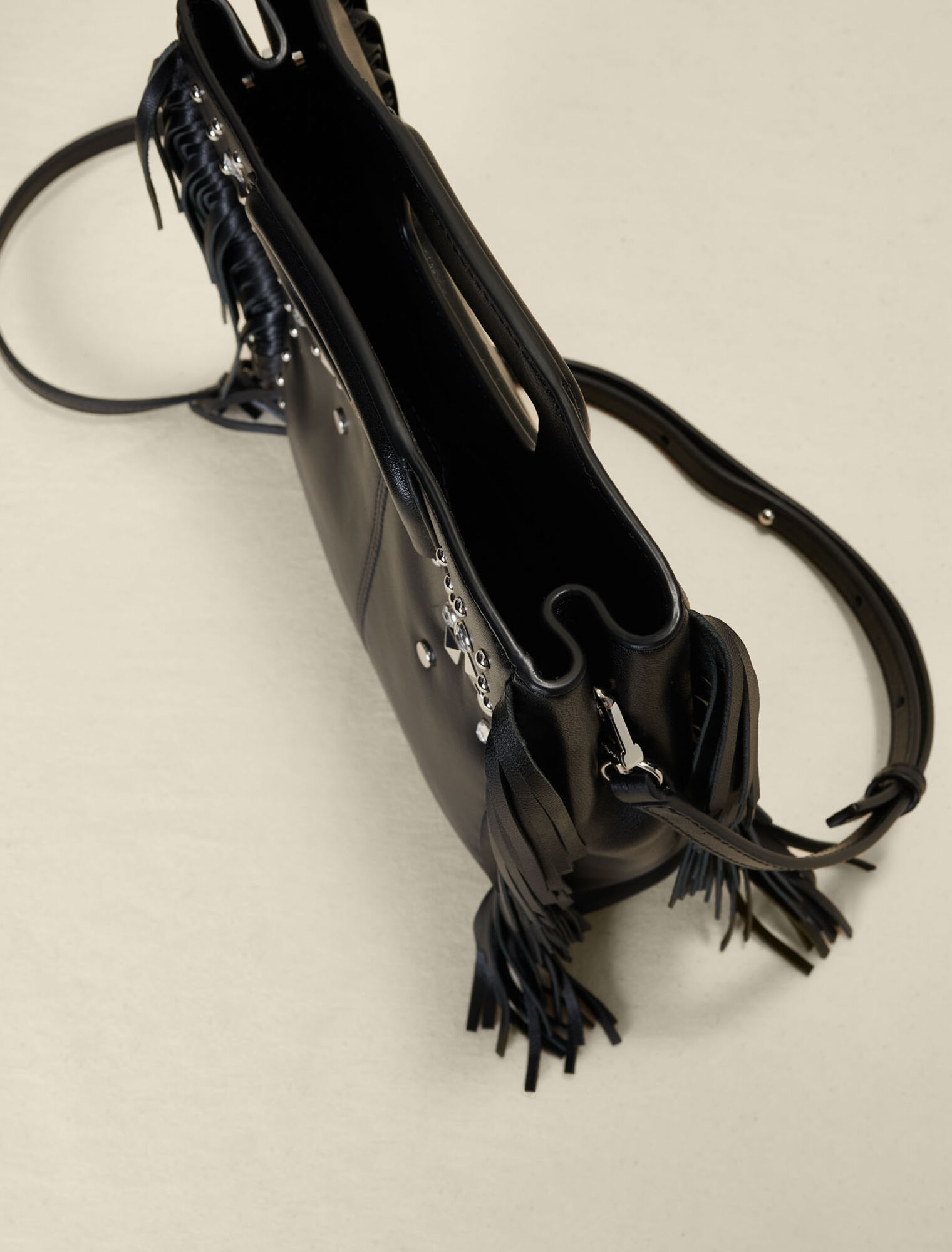 Studded leather M bag with fringing