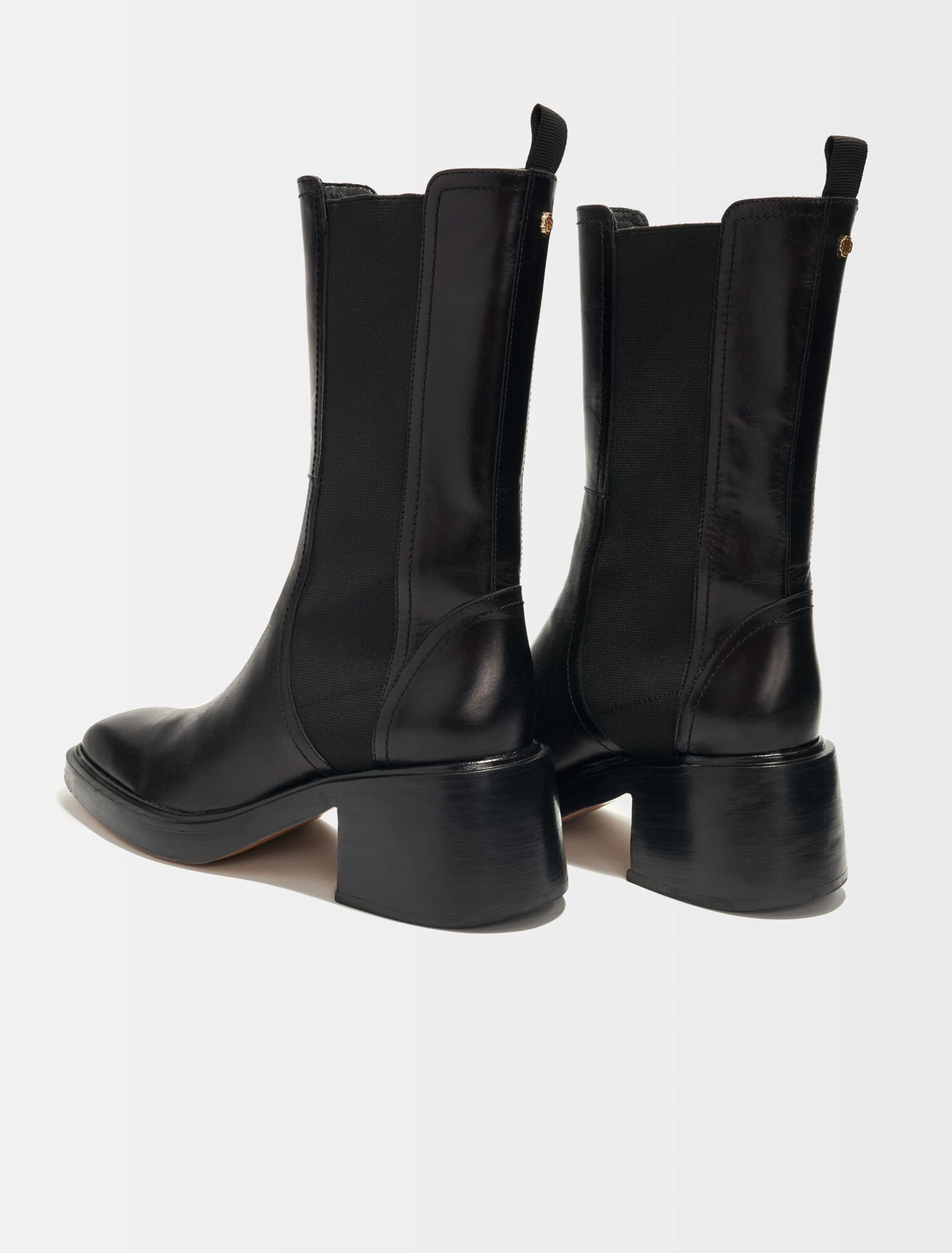 Black leather ankle boots and square toe