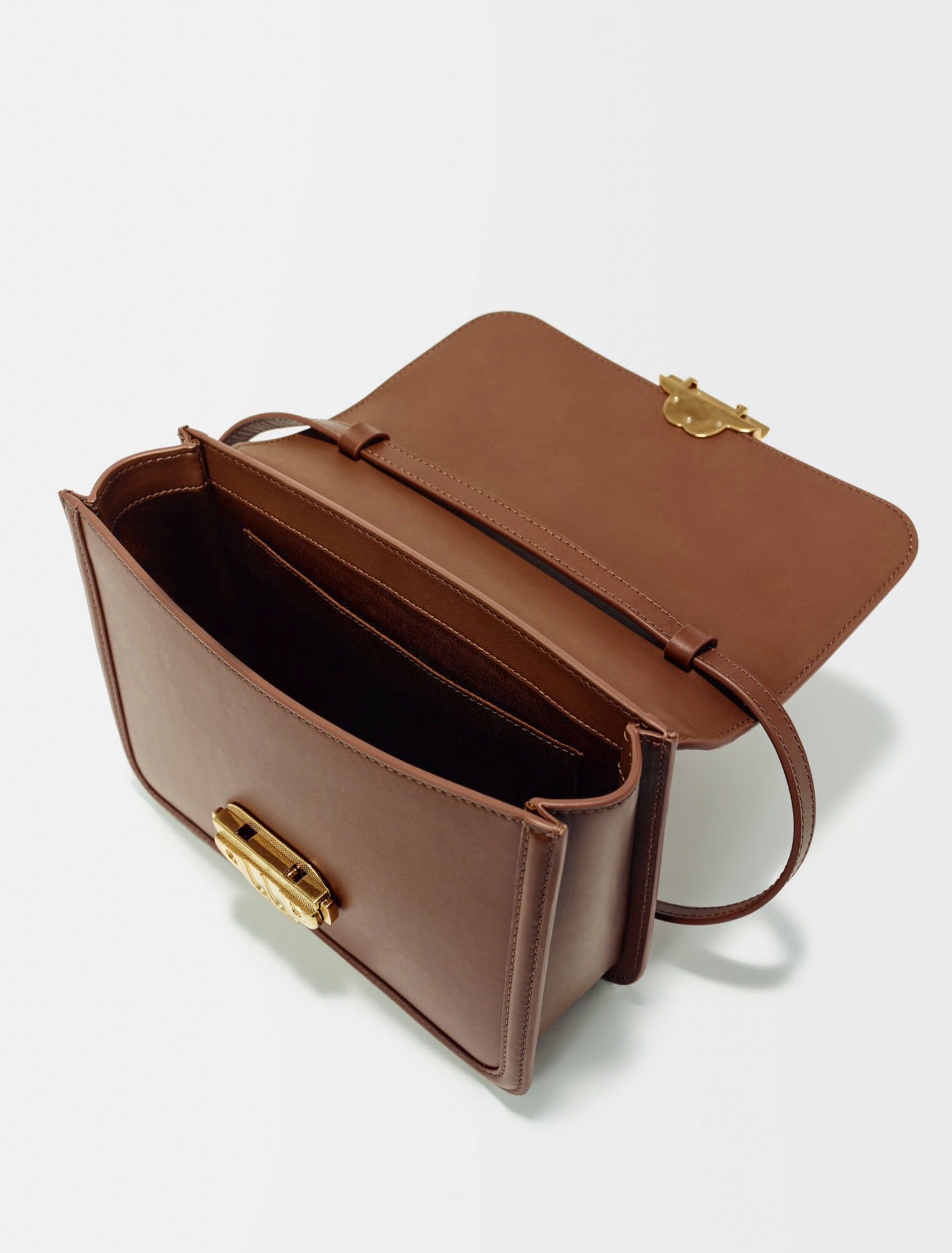 Leather bag with clover clasp