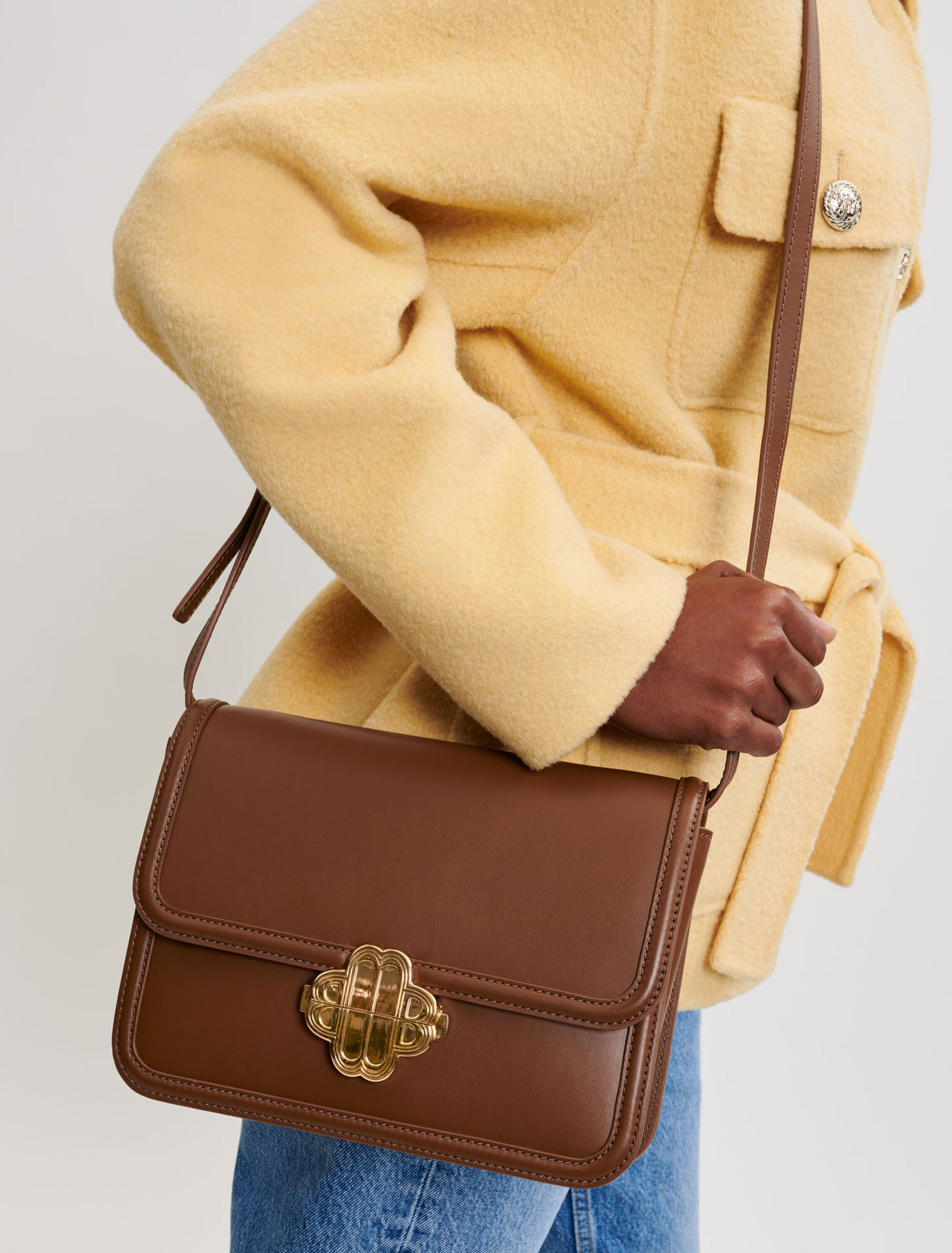 Leather bag with clover clasp