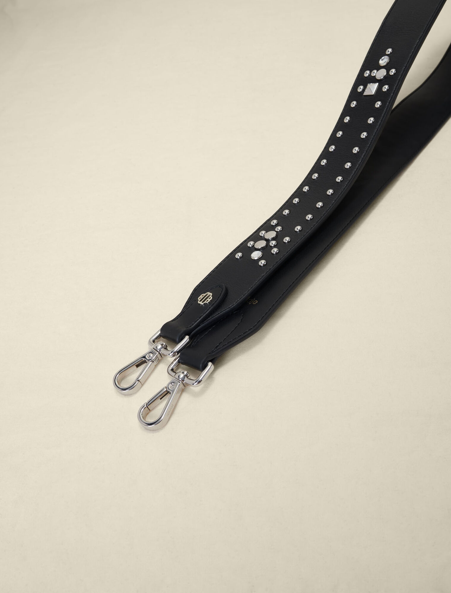 Studded leather shoulder strap