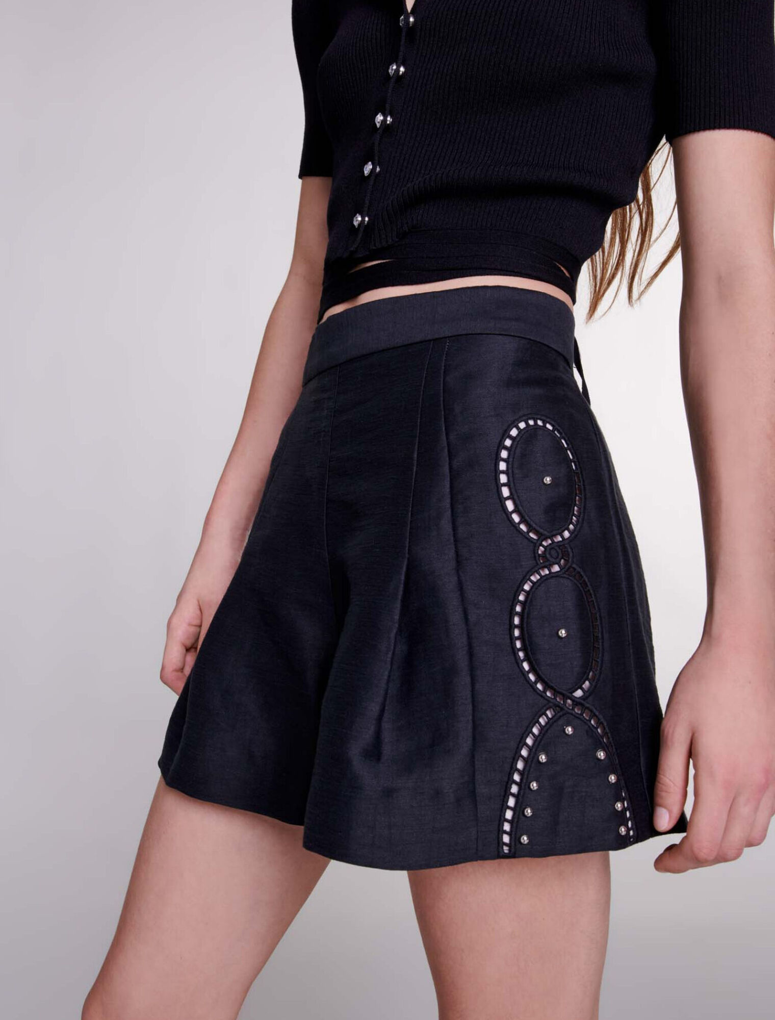 Openwork linen shorts with rivets