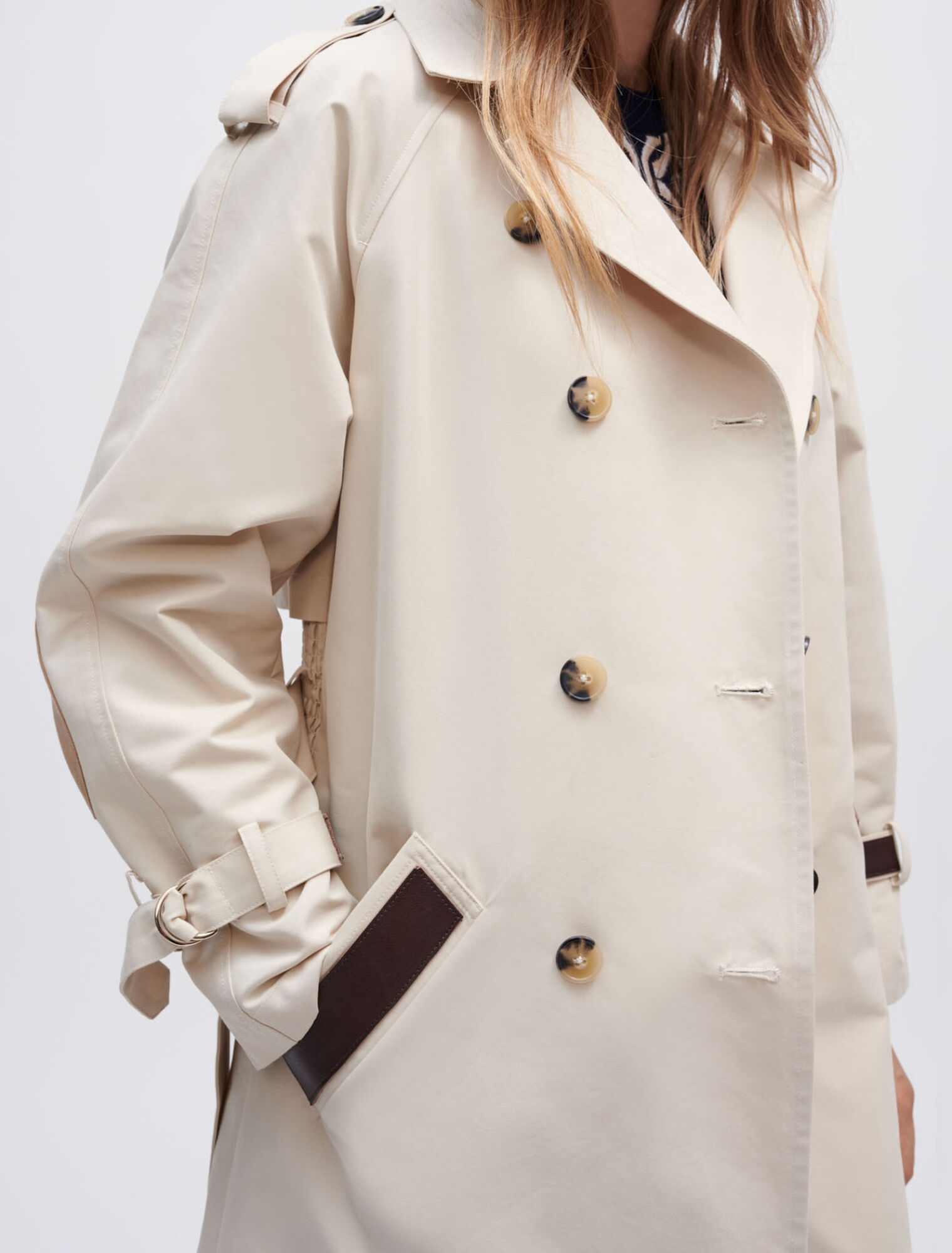 Trench coat with smocking at the back