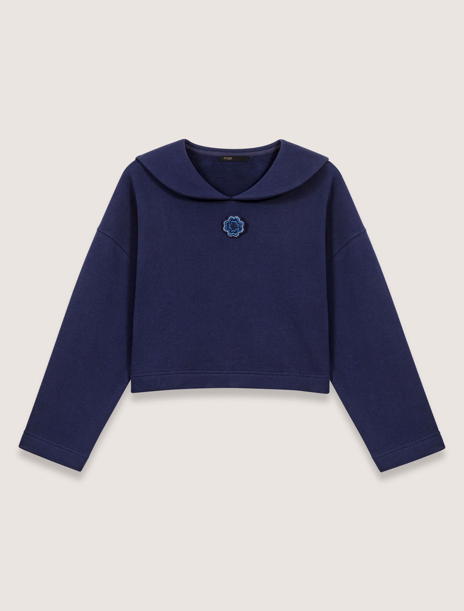 Short sweater with embroidery