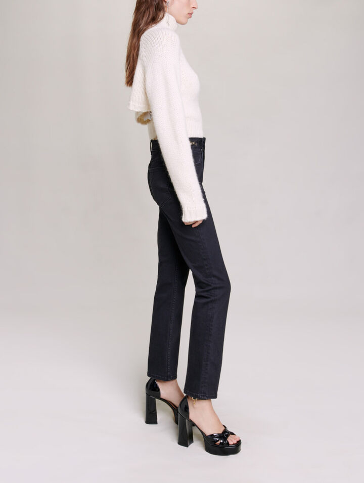 Jeans with curb chains and fringing