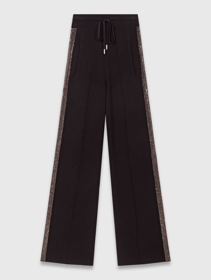 Trousers with rhinestone band