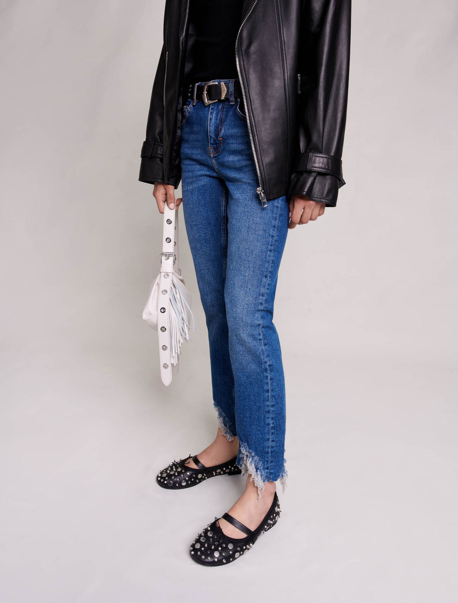 Slim-fit jeans, ripped at the bottom