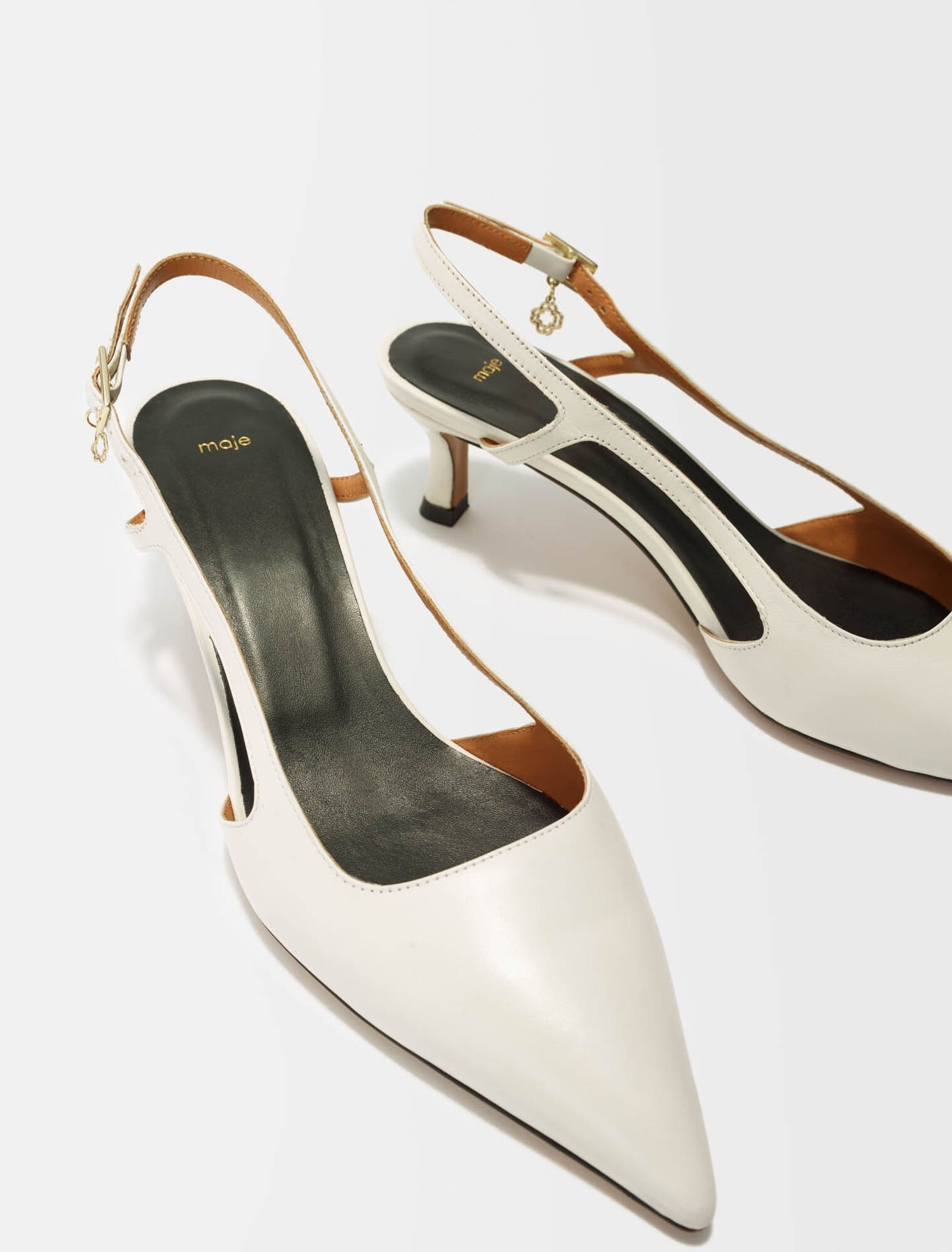 Pointed-toe pumps with straps