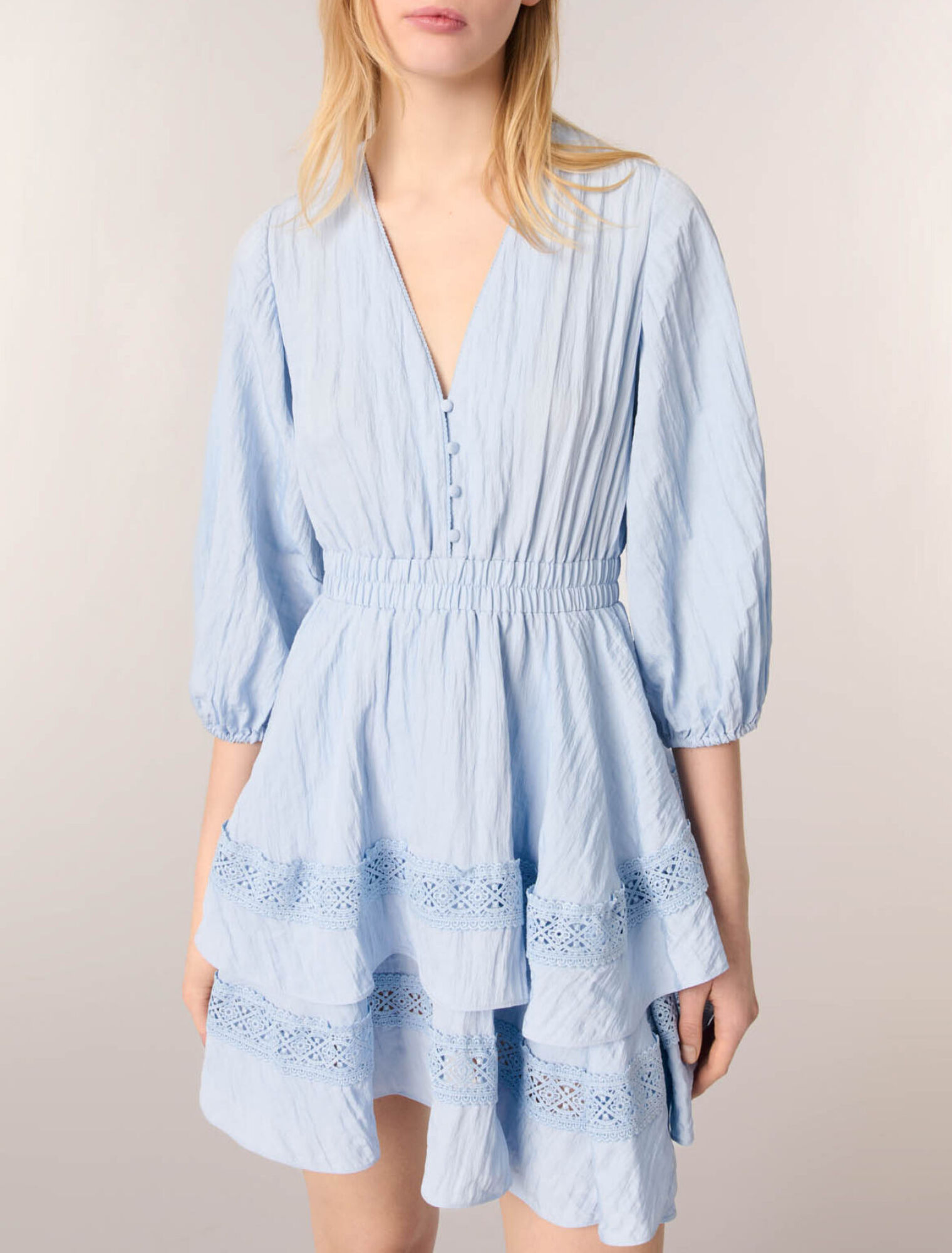 Dress with ruffles and lace details
