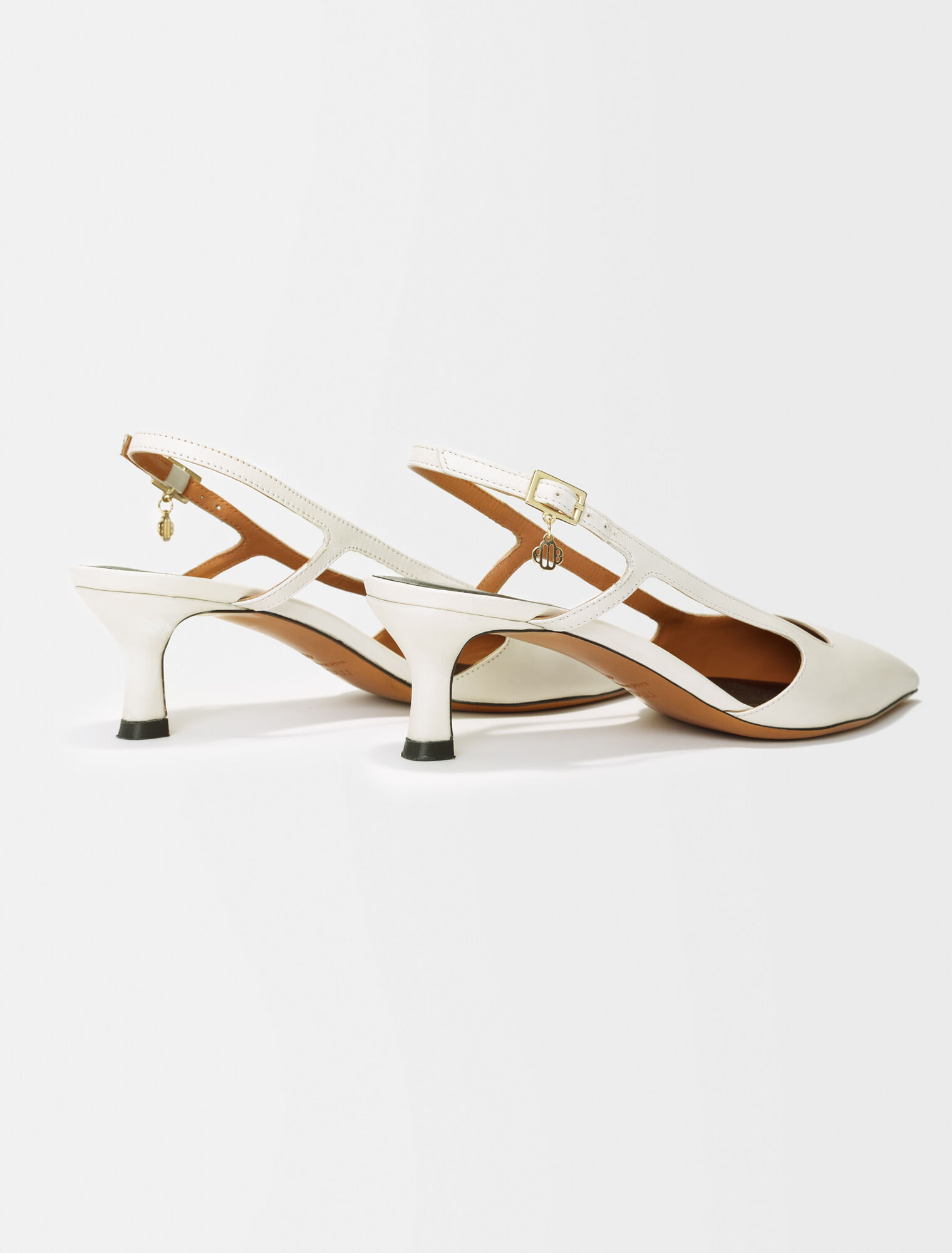 Pointed-toe pumps with straps