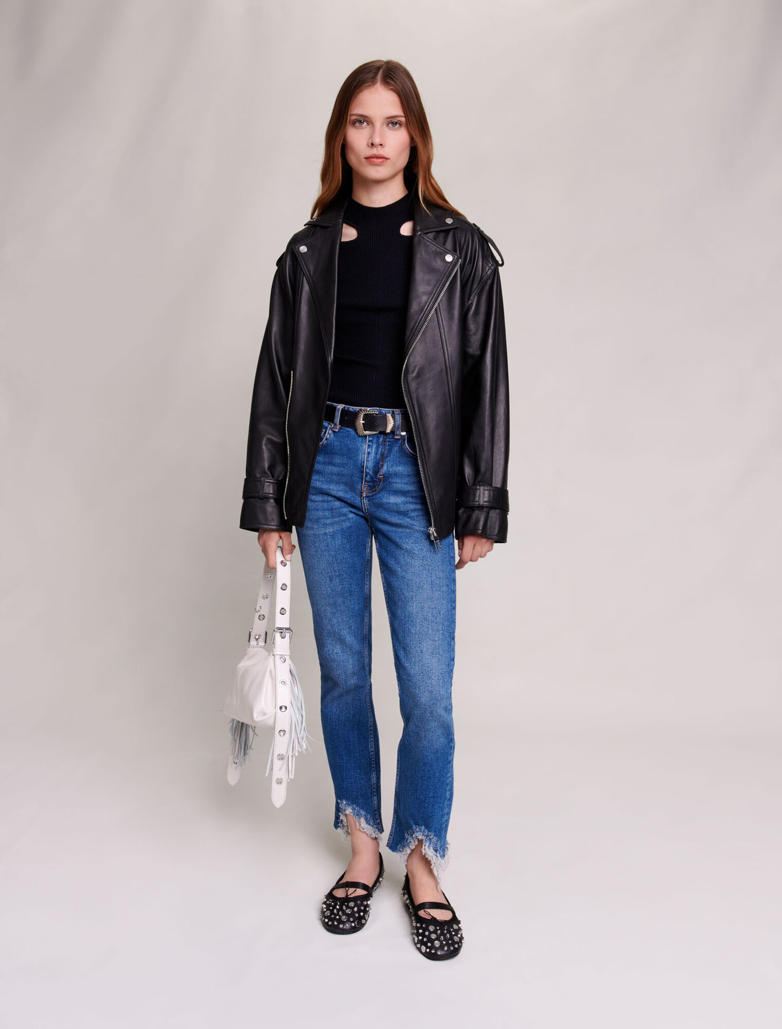 Slim-fit jeans, ripped at the bottom