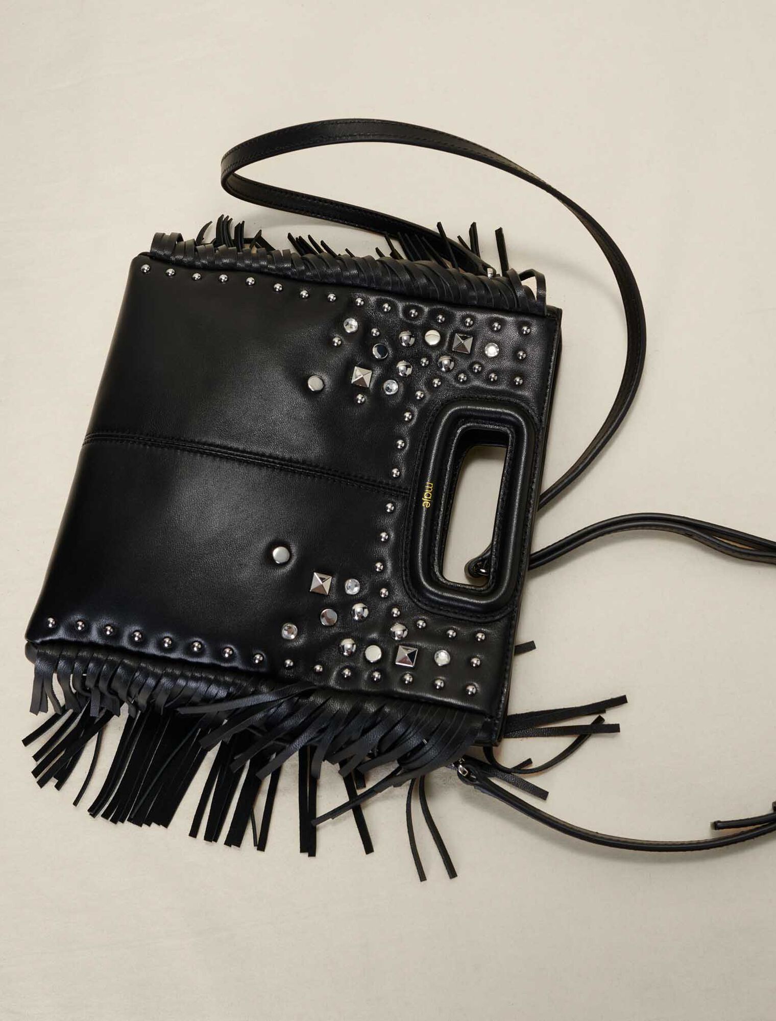 Studded leather M bag with fringing