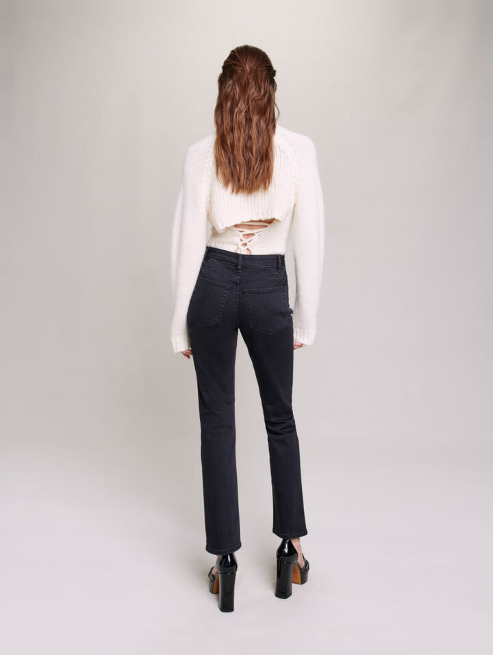 Jeans with curb chains and fringing