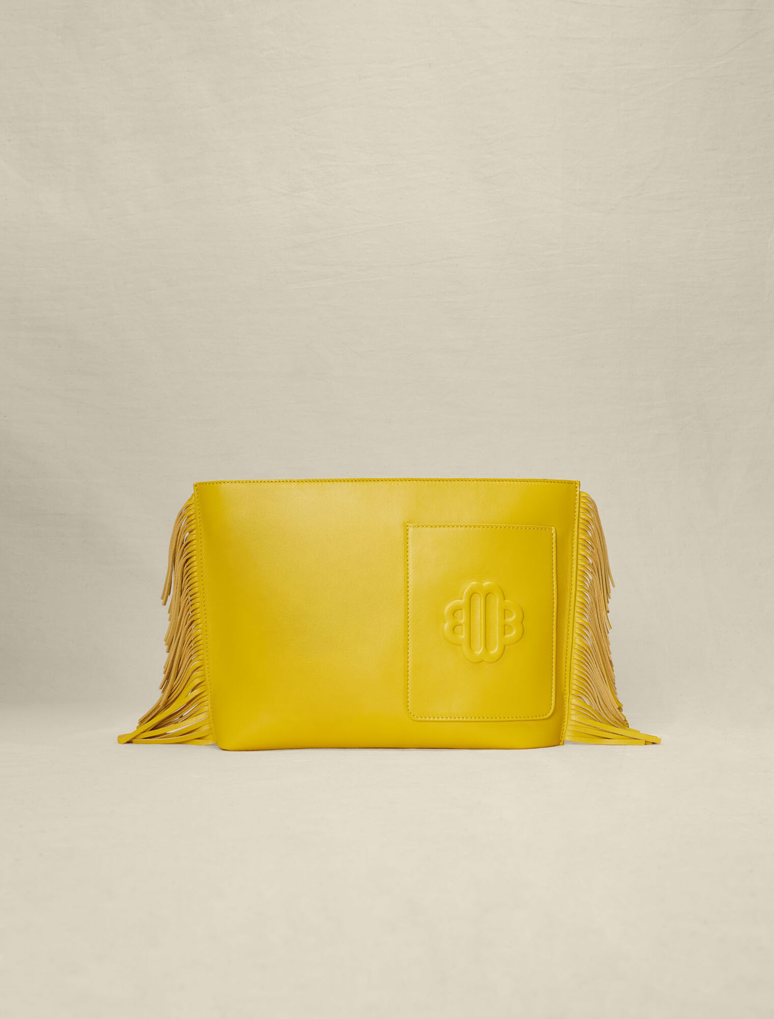 Fringed leather clutch bag