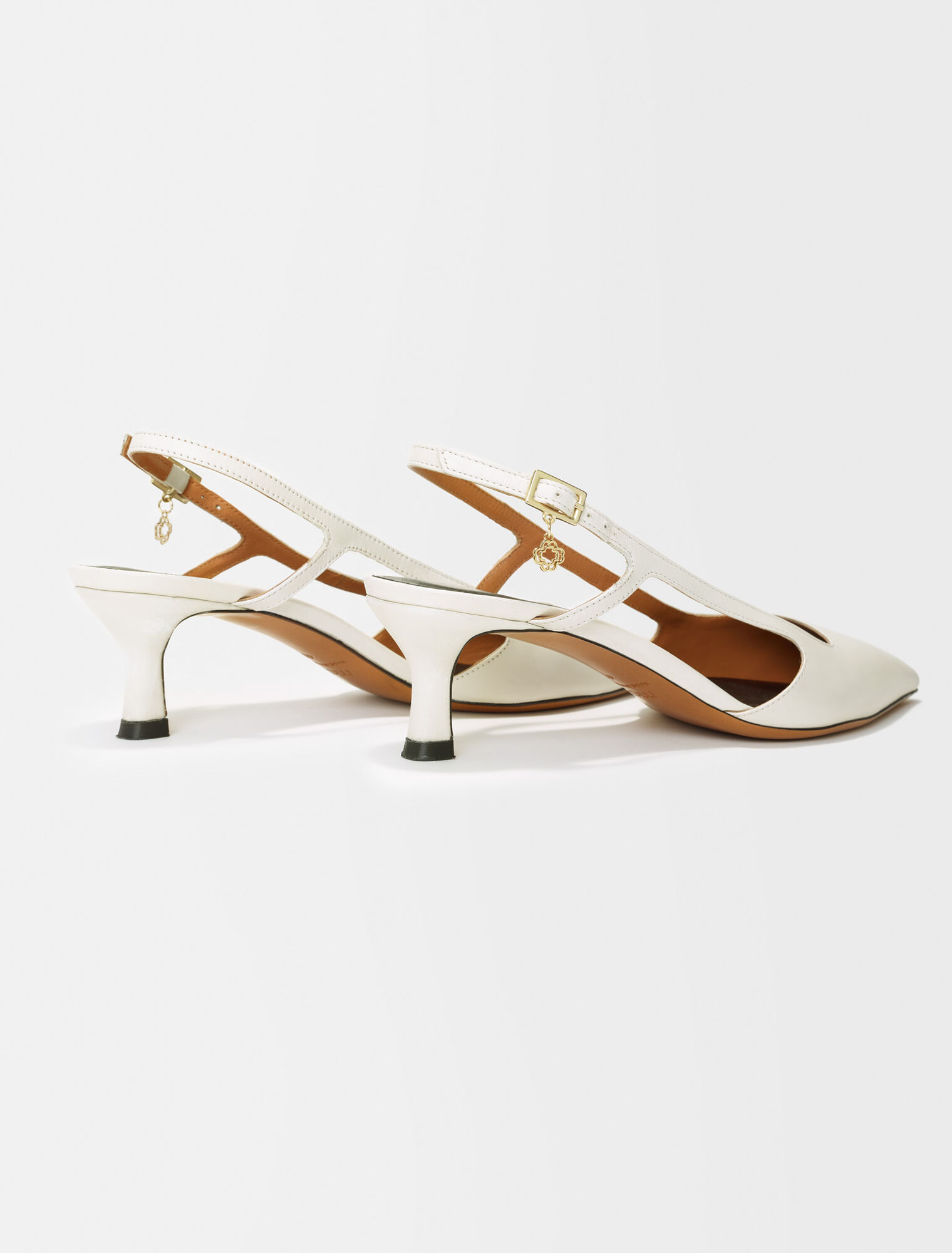 Pointed-toe pumps with straps