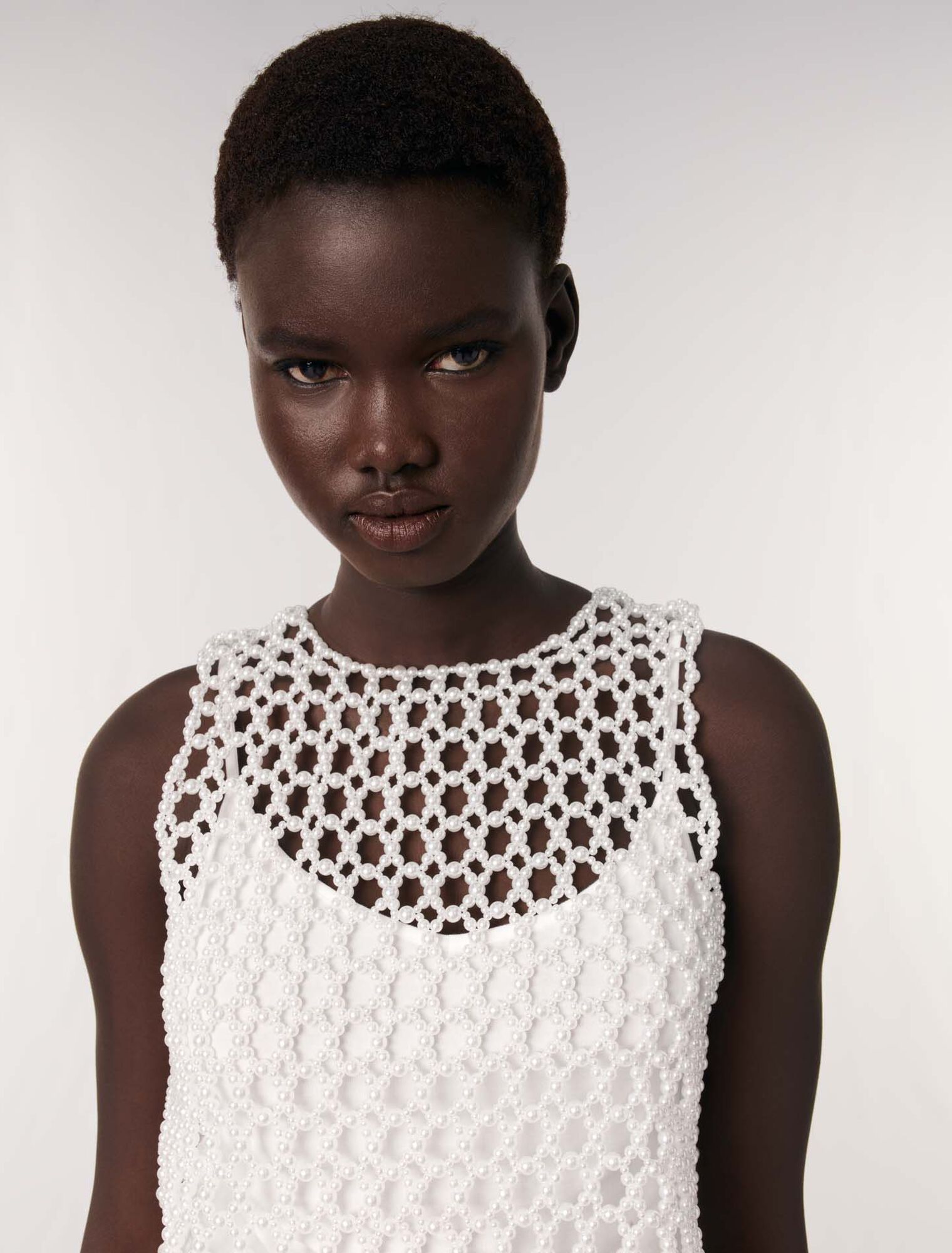 Cropped sleeveless beaded top