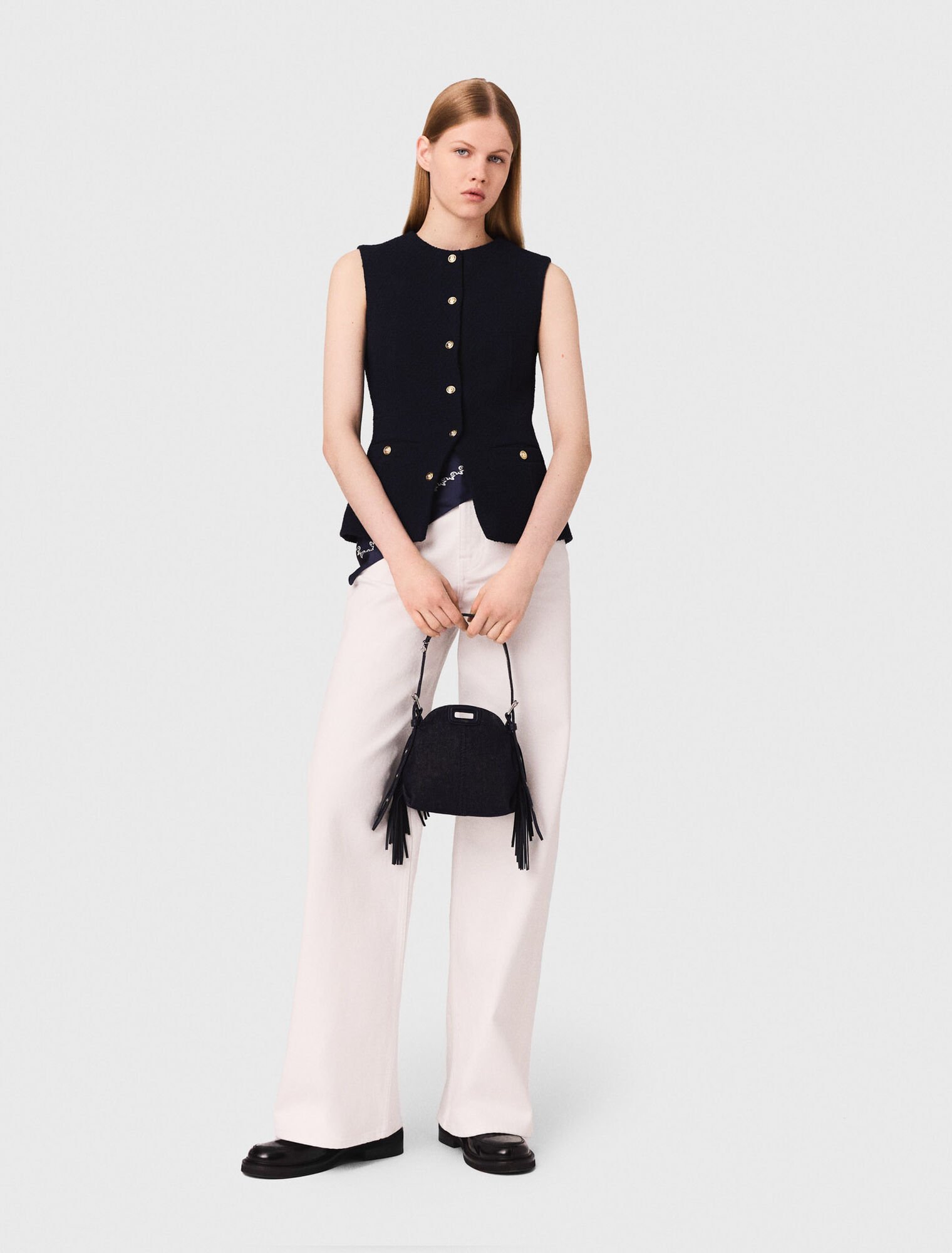 Long sleeveless tweed jacket