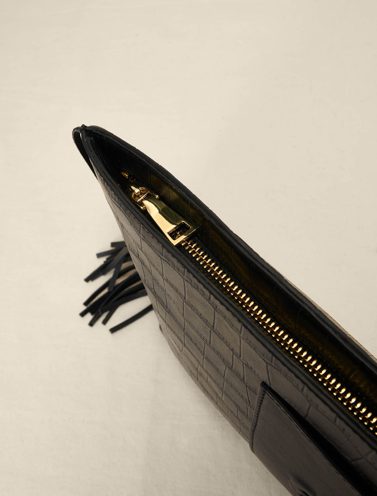 Embossed leather clutch bag