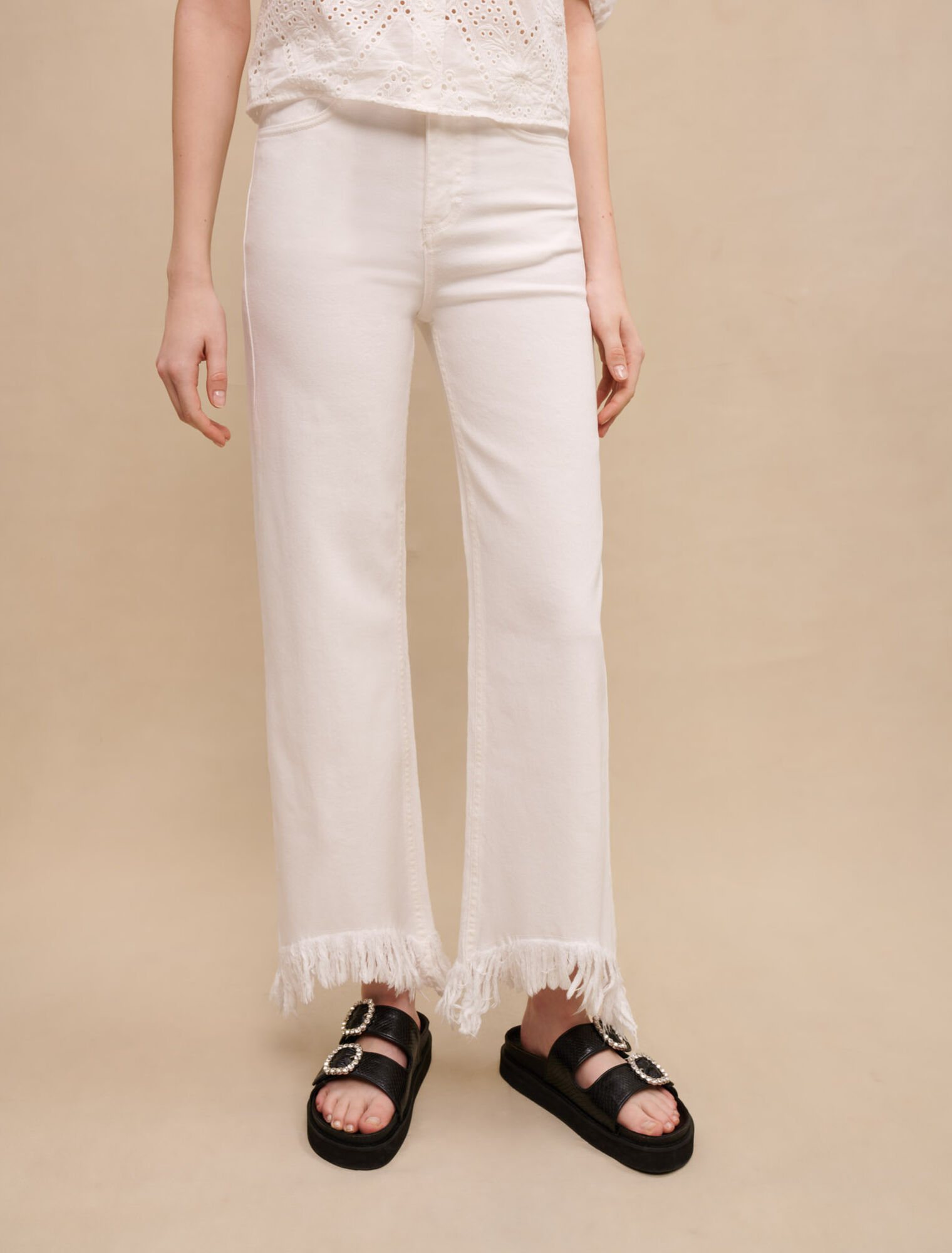Straight-leg jeans, ripped at bottom