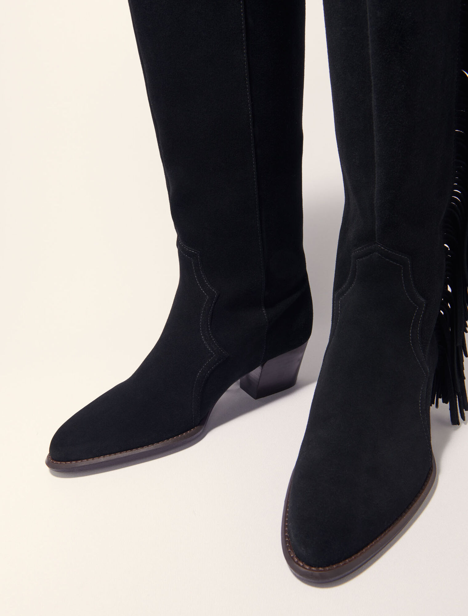 Fringed suede cowboy boots
