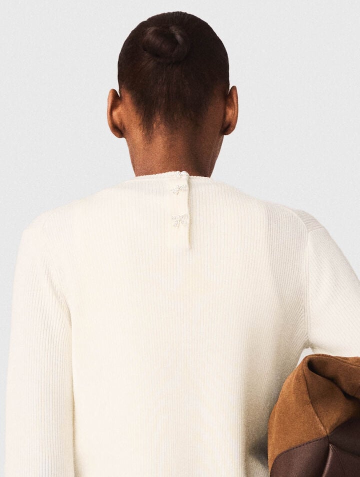 Sweater with jewelled buttons