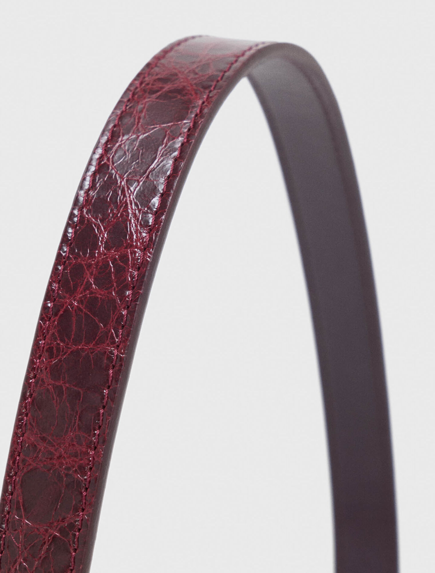 Slim leather belt with eyelets