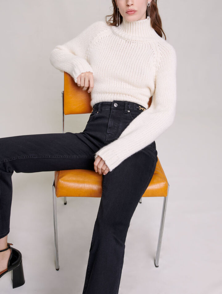 Jeans with curb chains and fringing