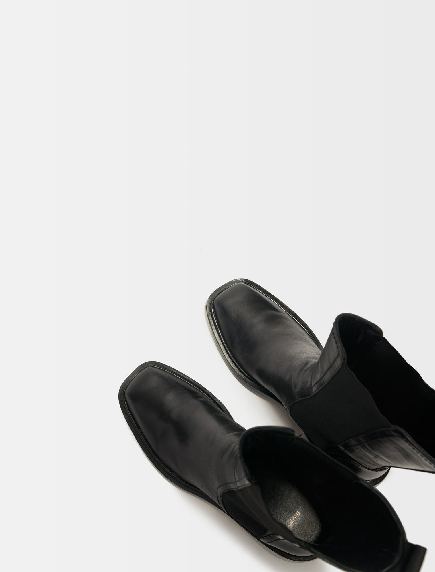 Black leather ankle boots and square toe