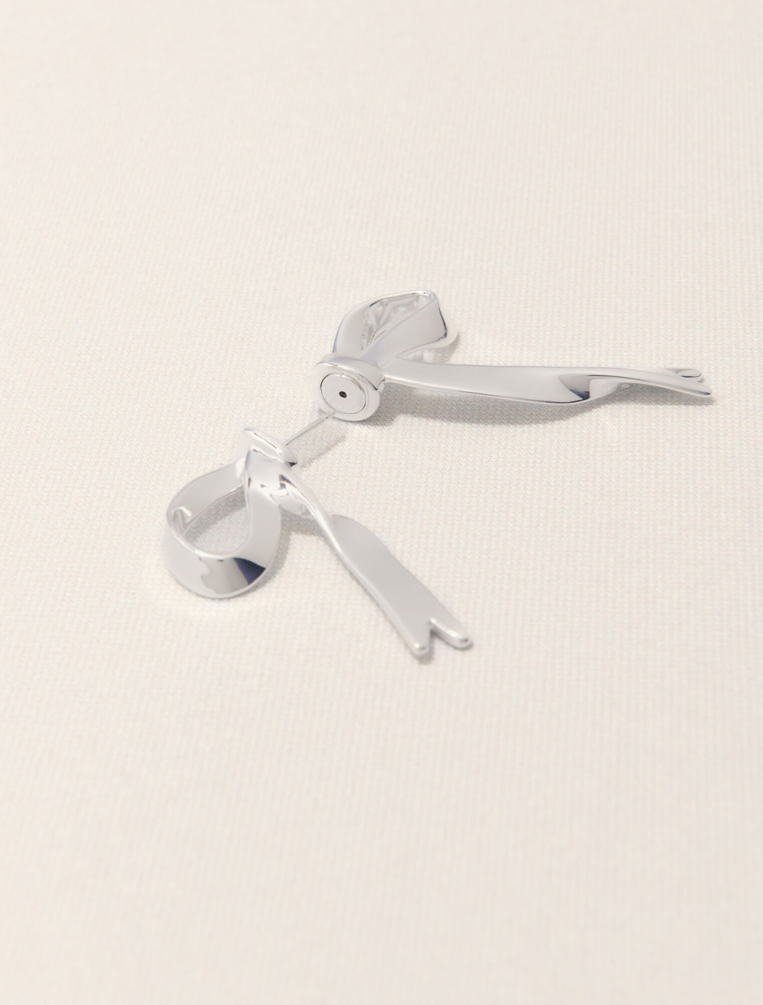 Silver bow earring