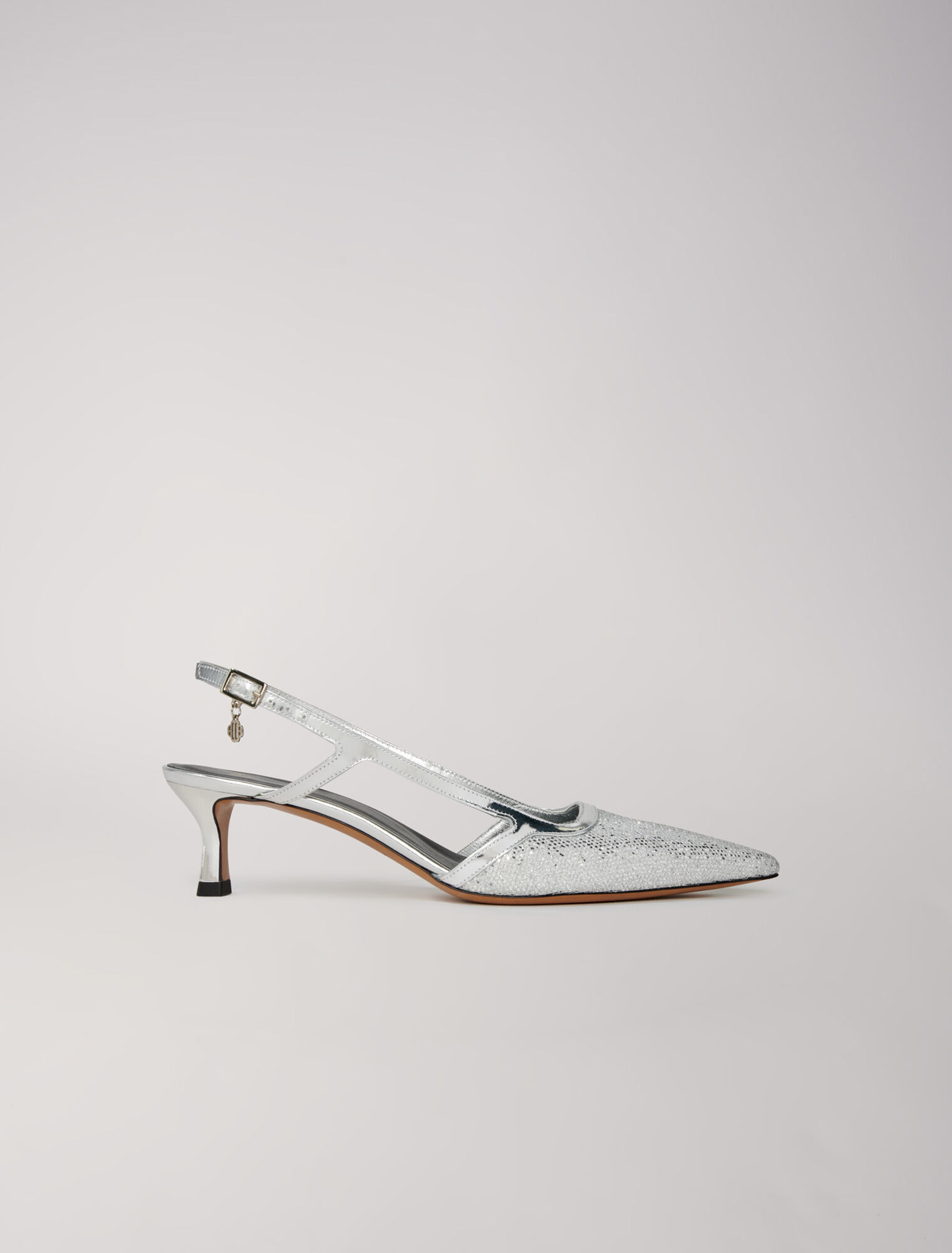Pointed silver pumps