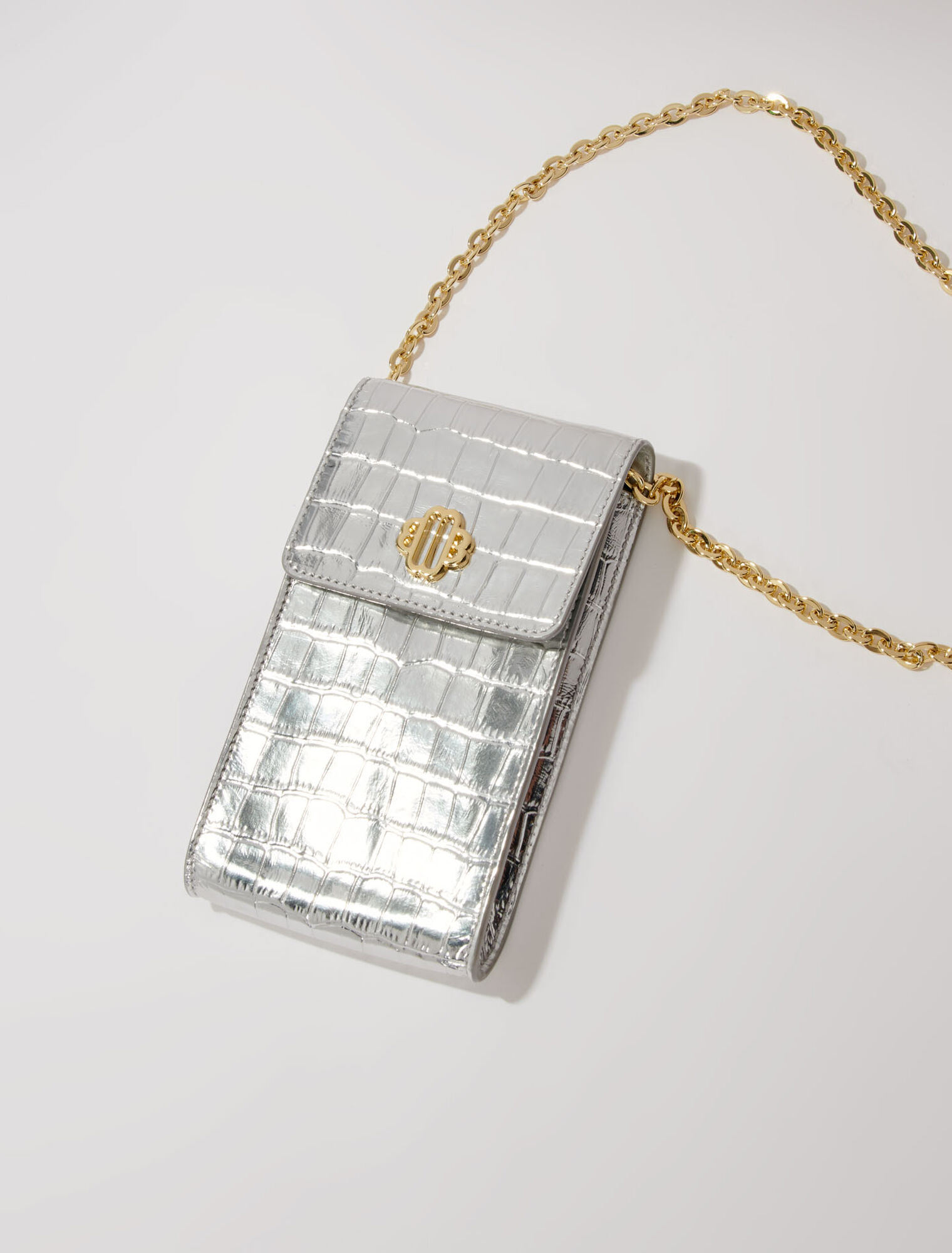 Metallic embossed leather clutch