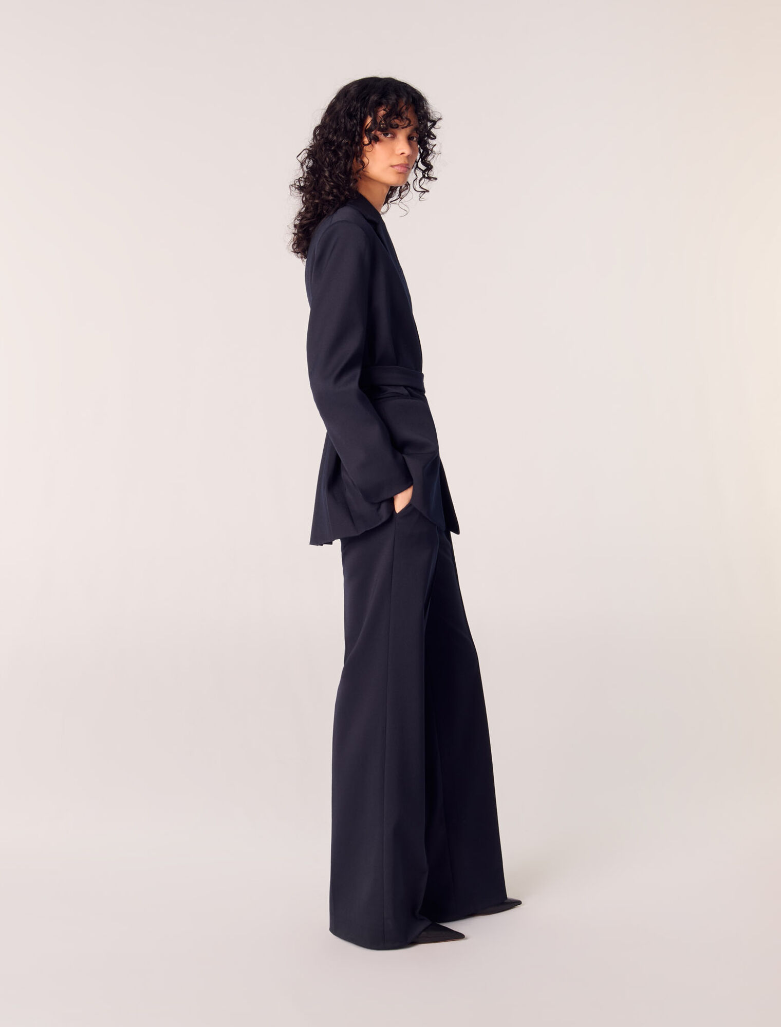 Suit jacket with pleated back