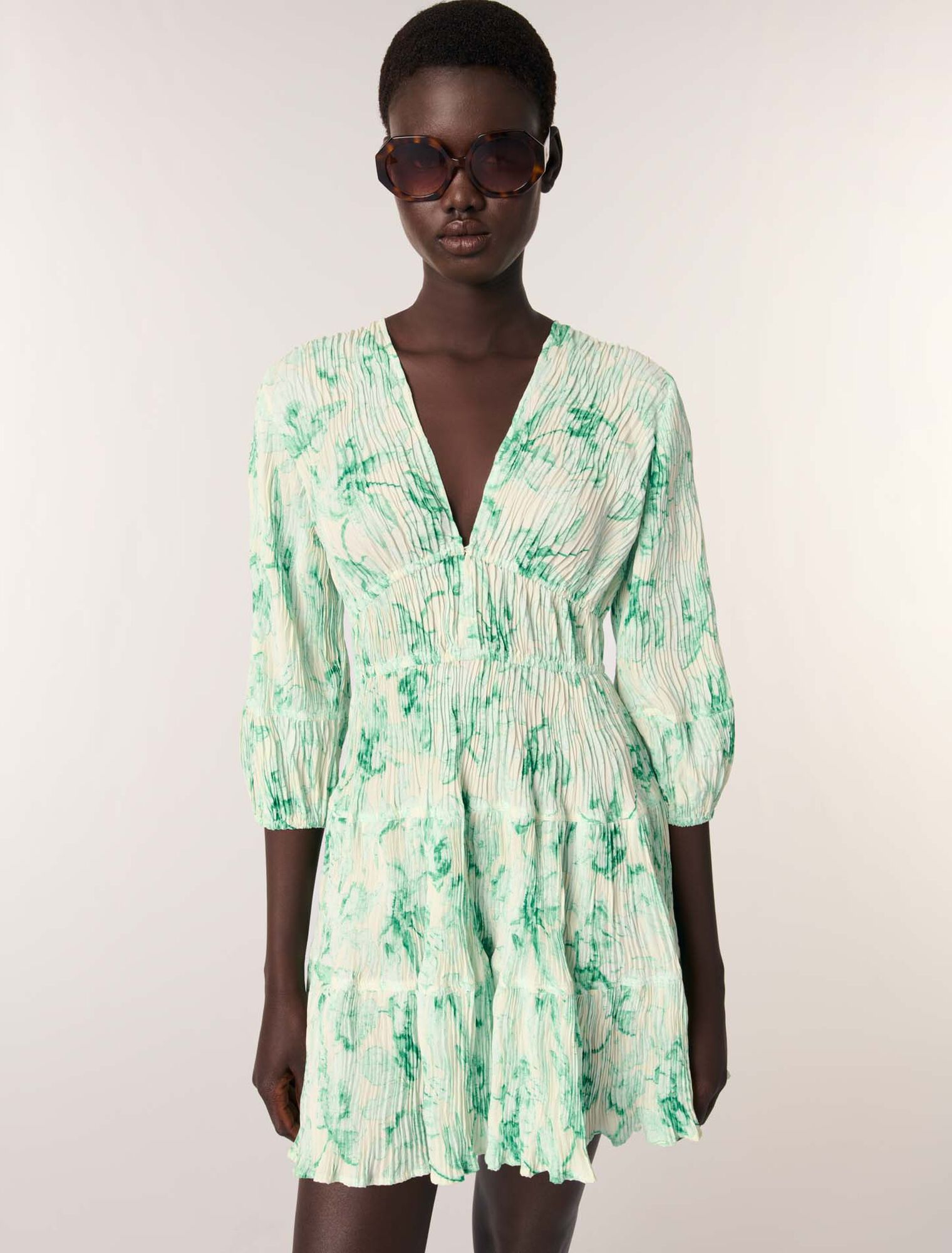 Patterned pleated mini dress