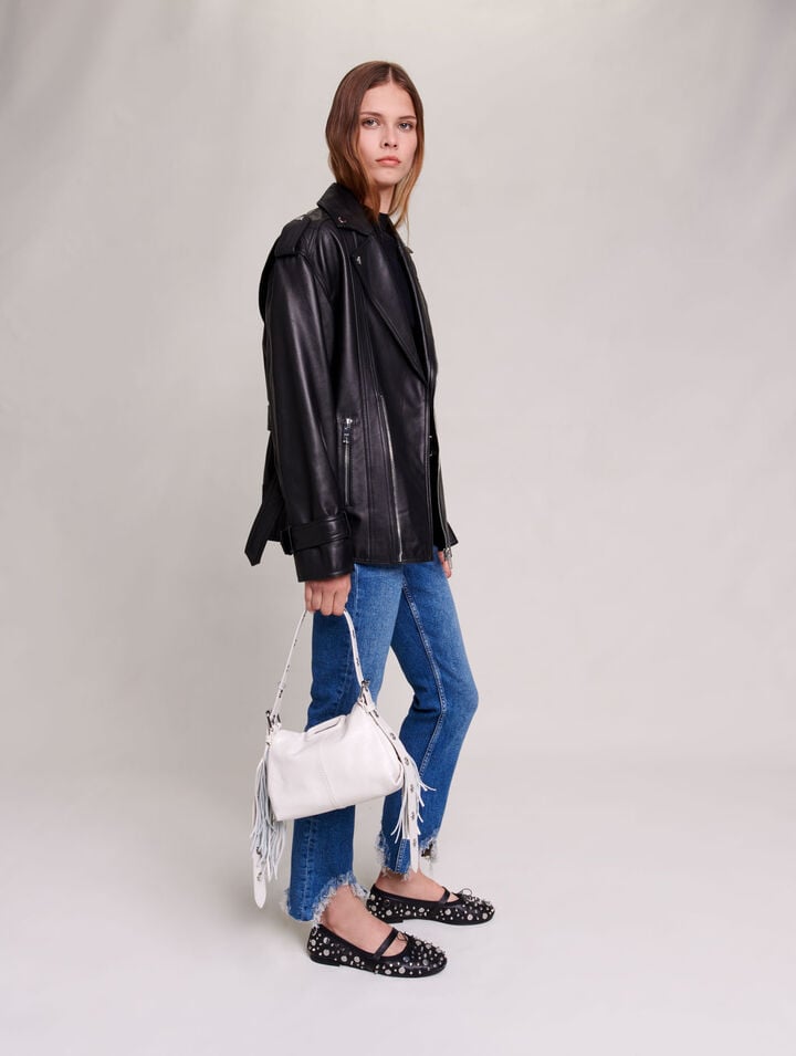 Slim-fit jeans, ripped at the bottom