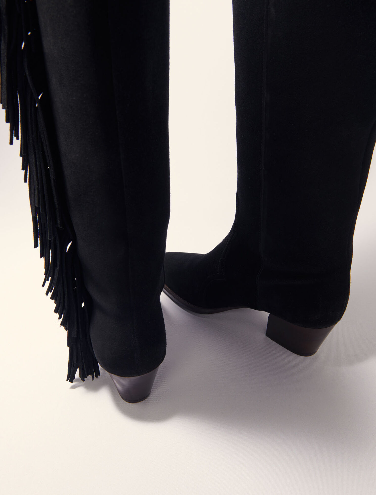 Fringed suede cowboy boots