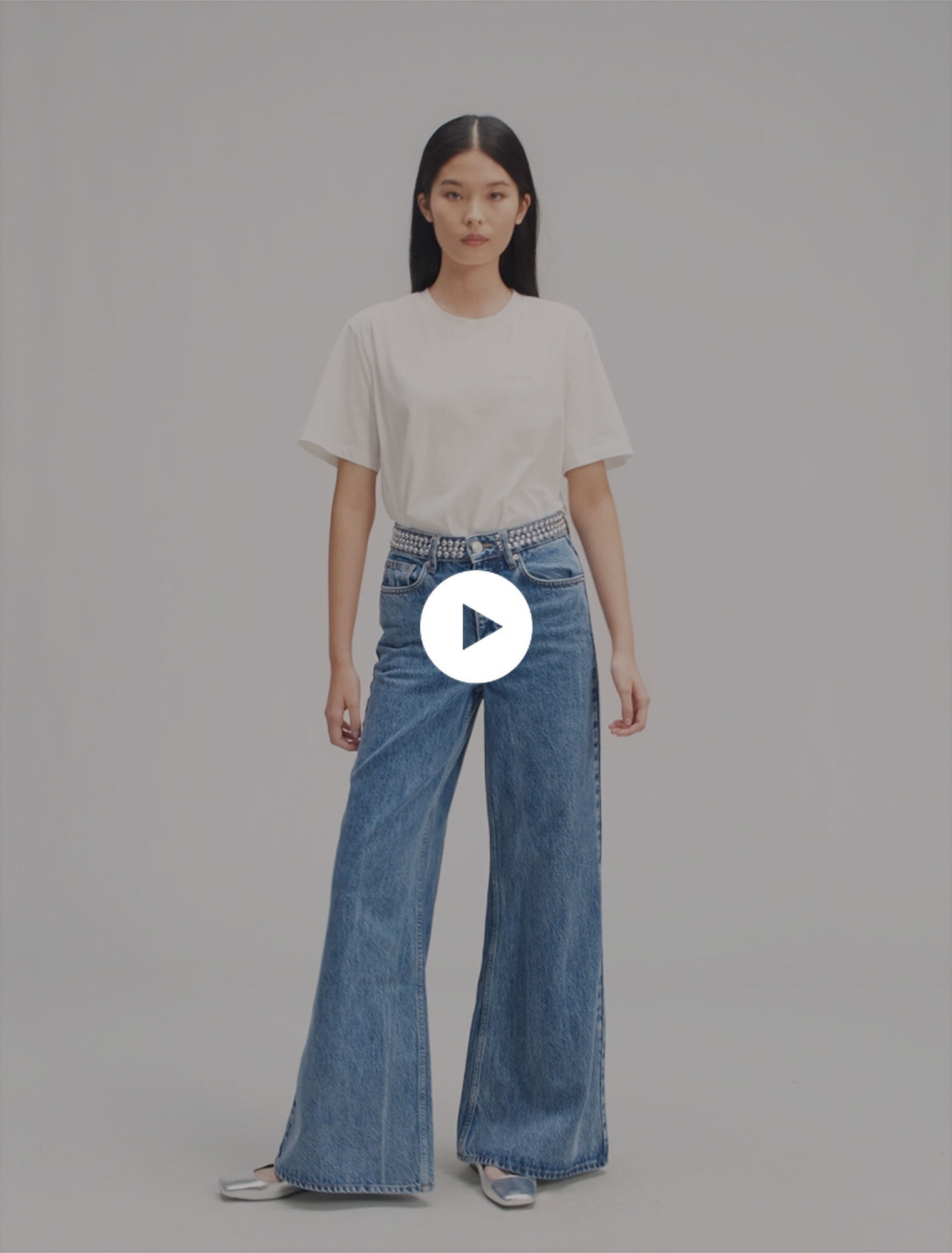 Flared jeans with studded waistband