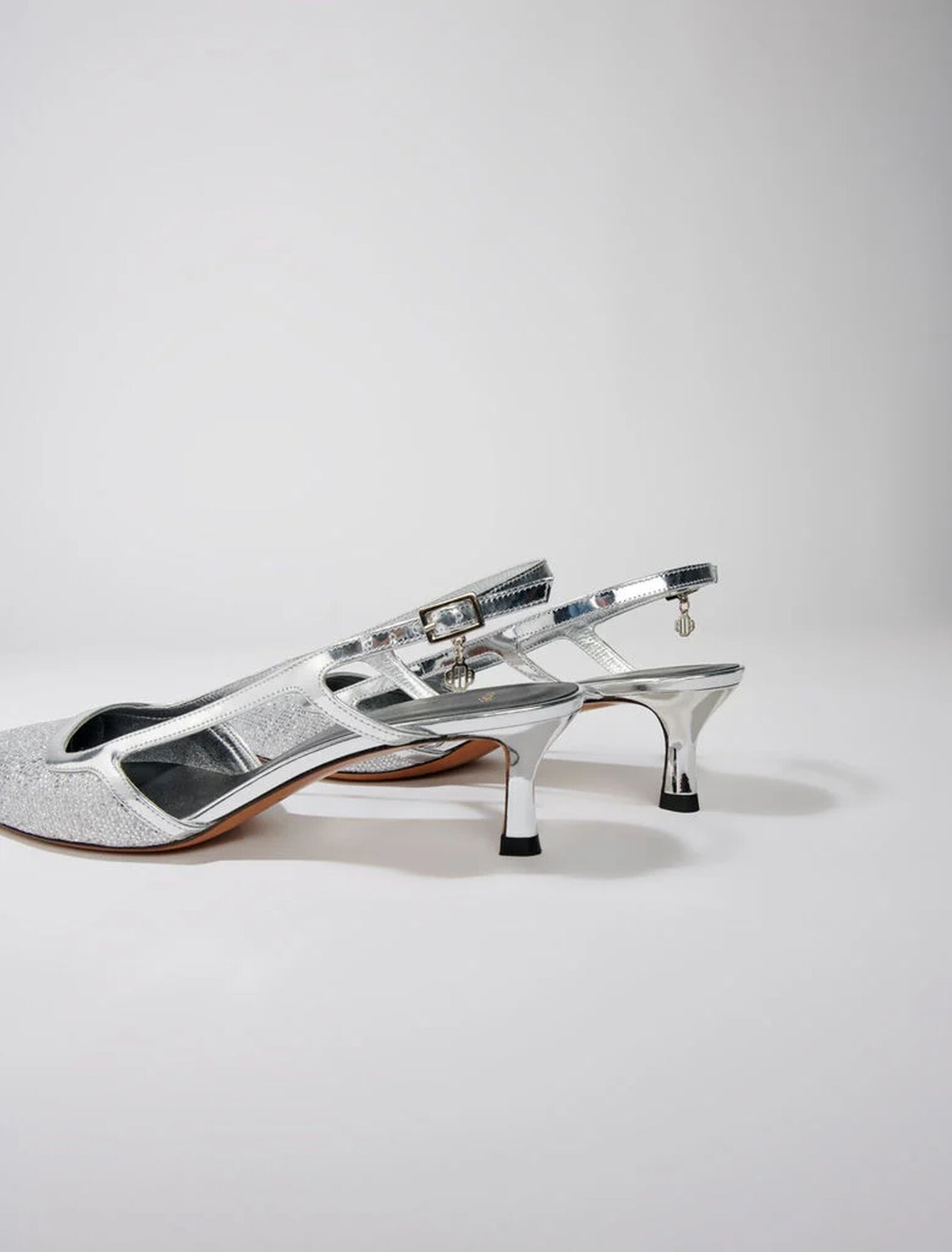 Pointed silver pumps