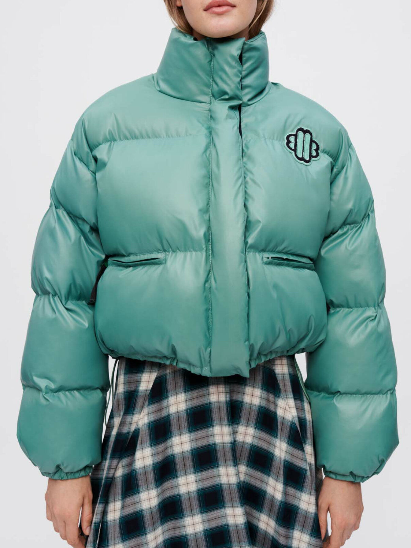 Green down jacket with Maje Clover patch
