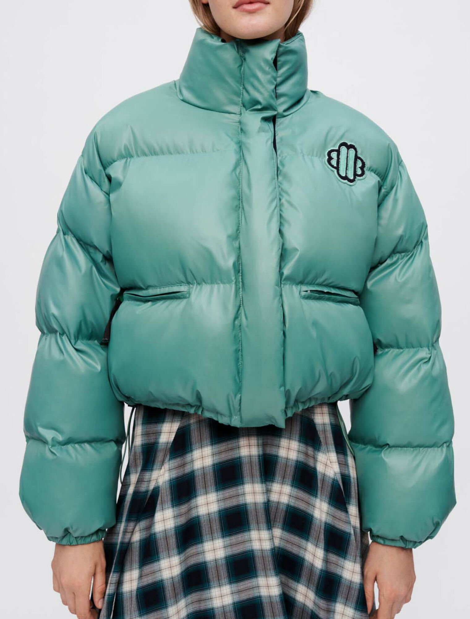 Green down jacket with Maje Clover patch