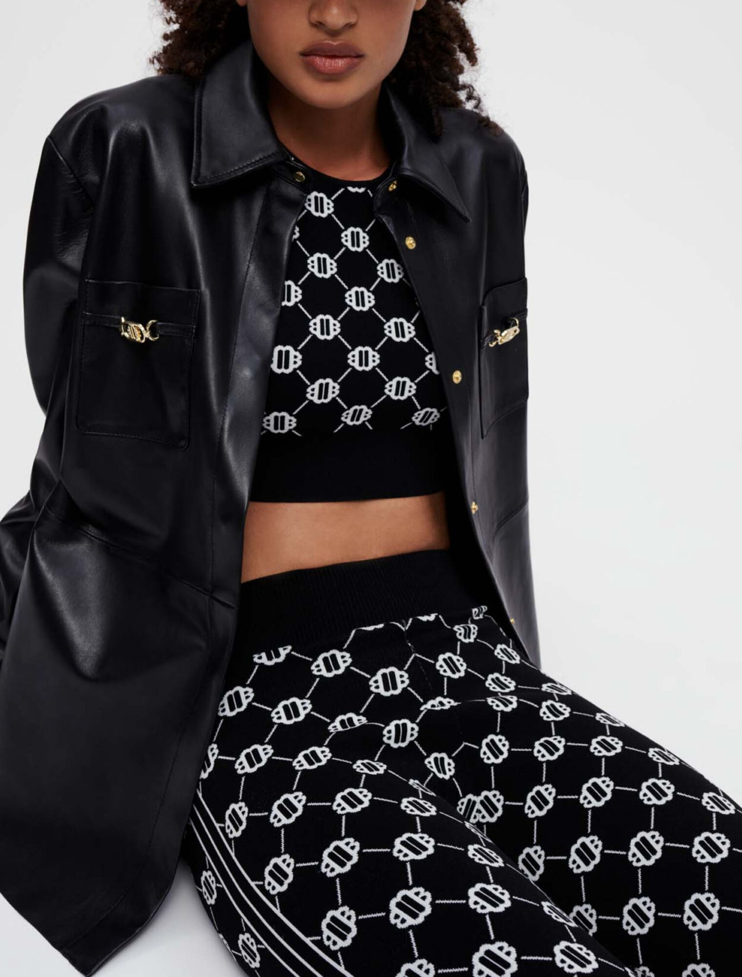 Black leather shirt with gold horsebits