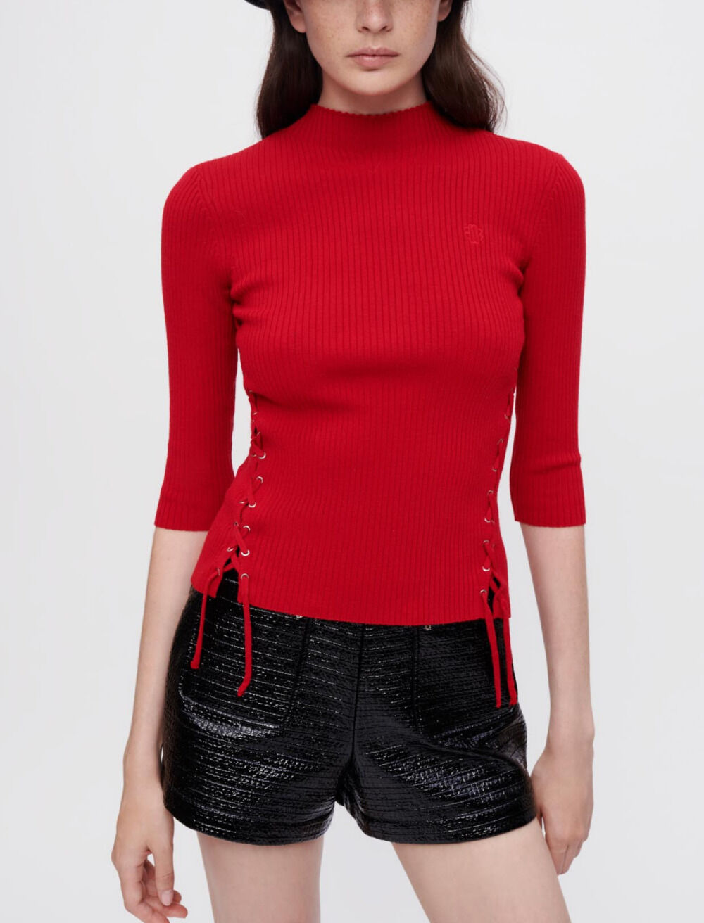 Sweater with silver eyelets